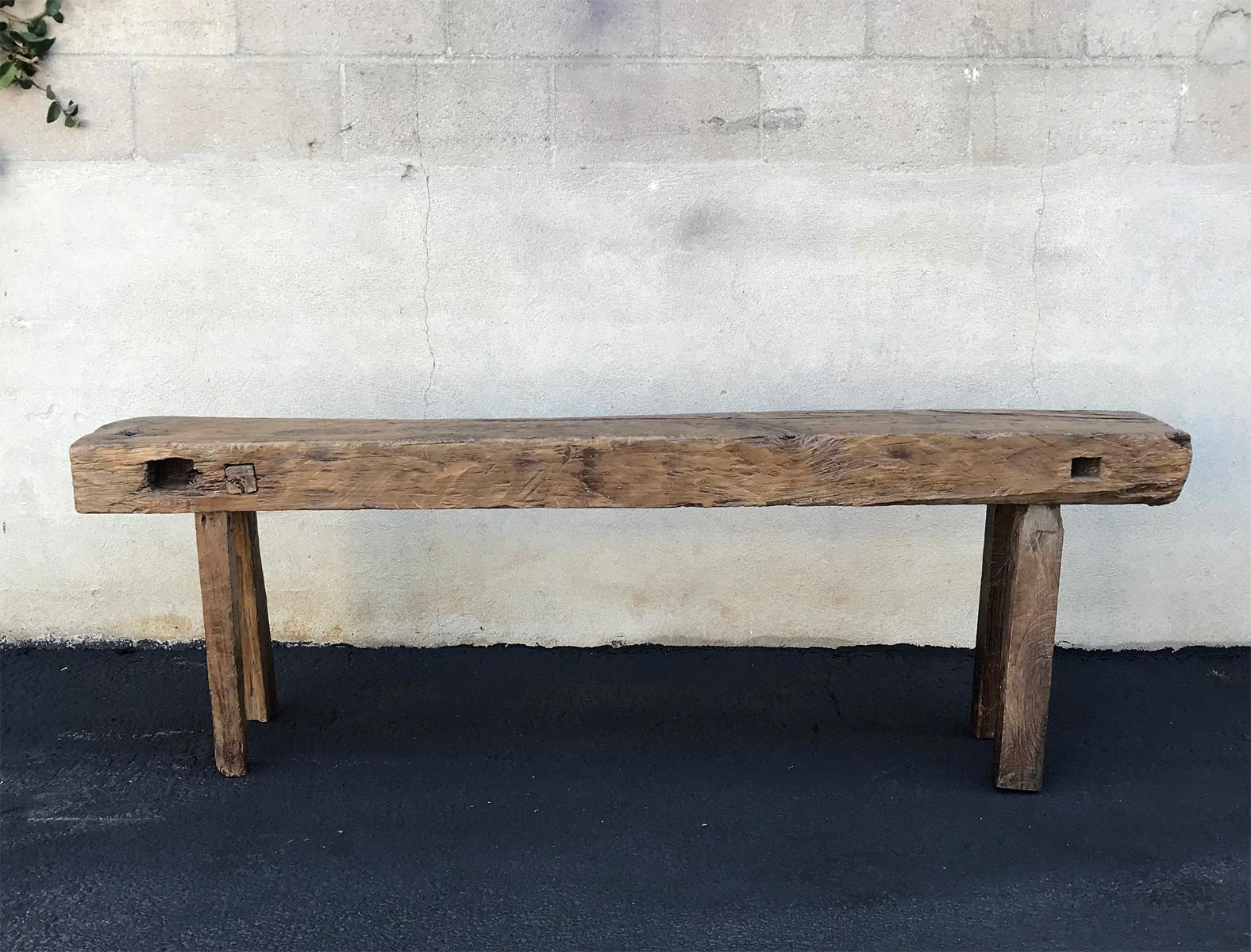 Low all original carpenter's bench from the highlands of Guatemala. Shows many years of use, as saw marks.
Legs on one side have been exposed to fire and are blackened, but non the less sturdy and clean, not smudgy.
This narrow console would be