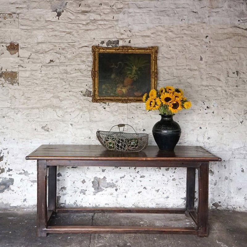 Antique rustic wooden farmhouse dining table.

Simple lines that would work in both a traditional or more modern interior setting.

A two plank top with cleated ends on a simple refectory base with four stretchers.

Wonderful patina and