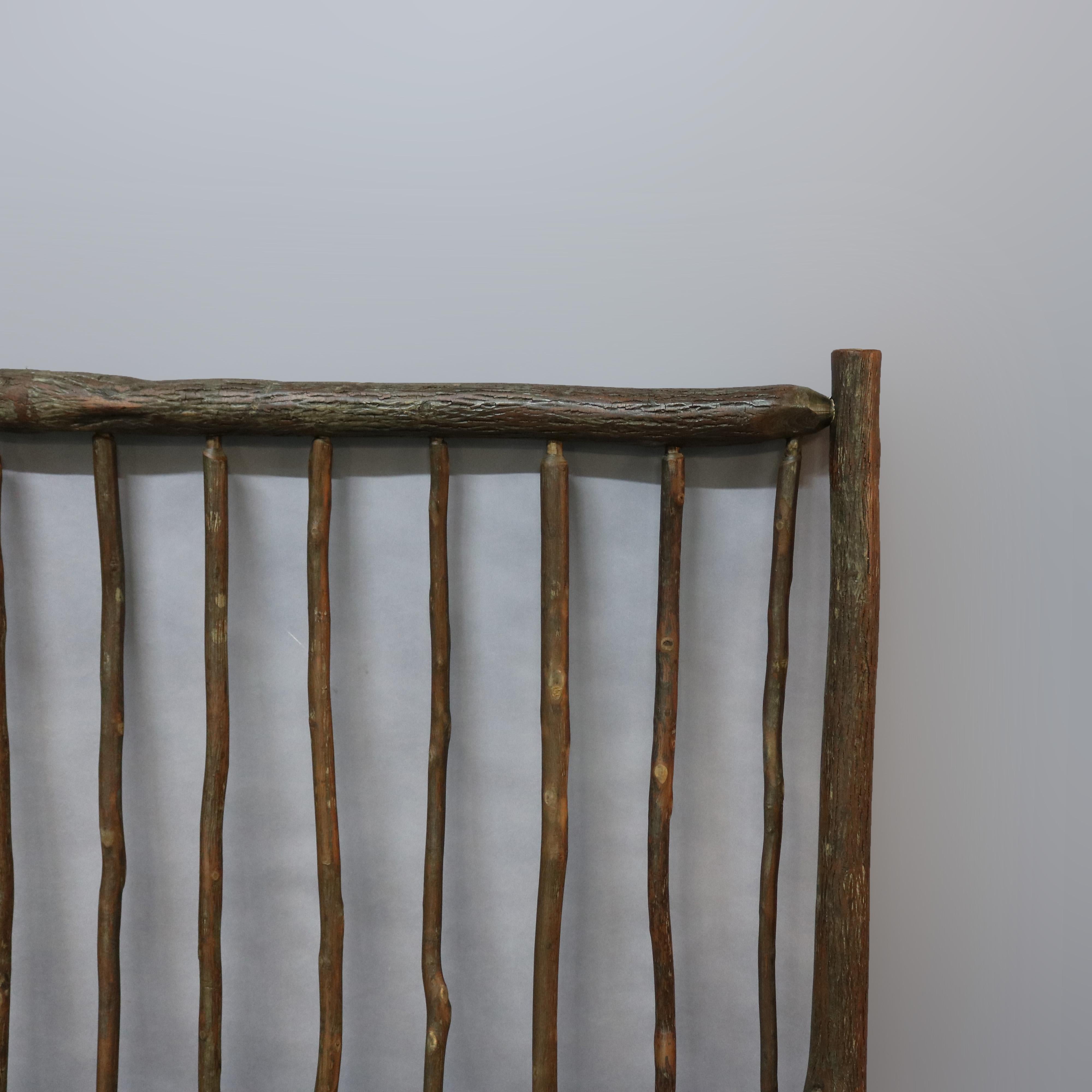 An antique rustic Adirondack queen size headboard in the manner of Old Hickory offers stick form construction, 20th century

Measures: 60