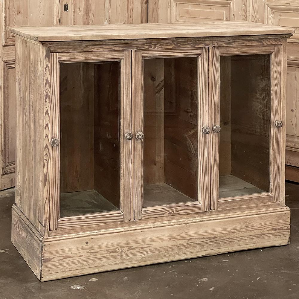 Antique Rustic Pine Bin Style Store Counter in Stripped Pine is a truly unusual find! Created for a store, it was designed to display tall items bin-style with glass fronts to easily identify the variations available. Note two turned pine knobs