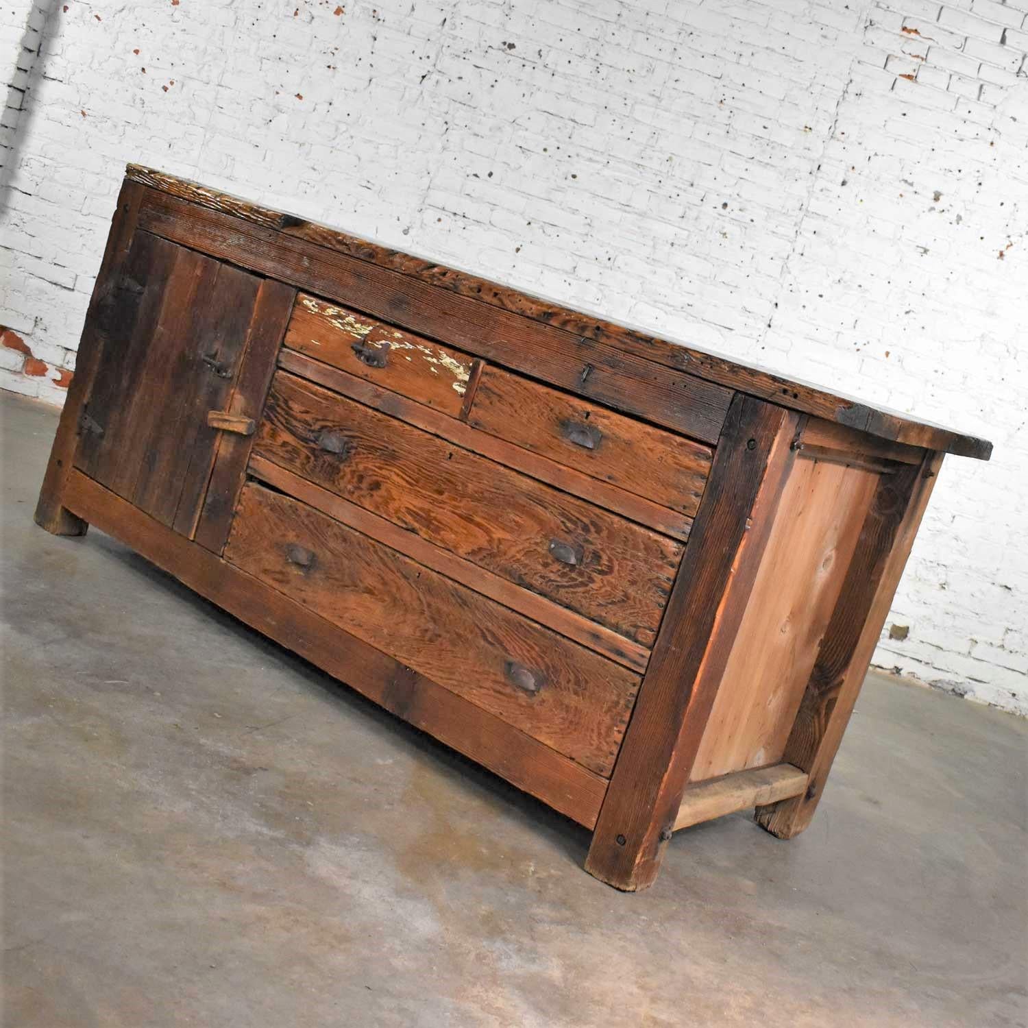 Handsome antique pine factory cabinet or work bench with gorgeous natural rustic primitive age patina. It is in wonderful ready to use condition. Very solid with lots of fabulous nicks, dings, and age and use related beauty! Please see photos, circa