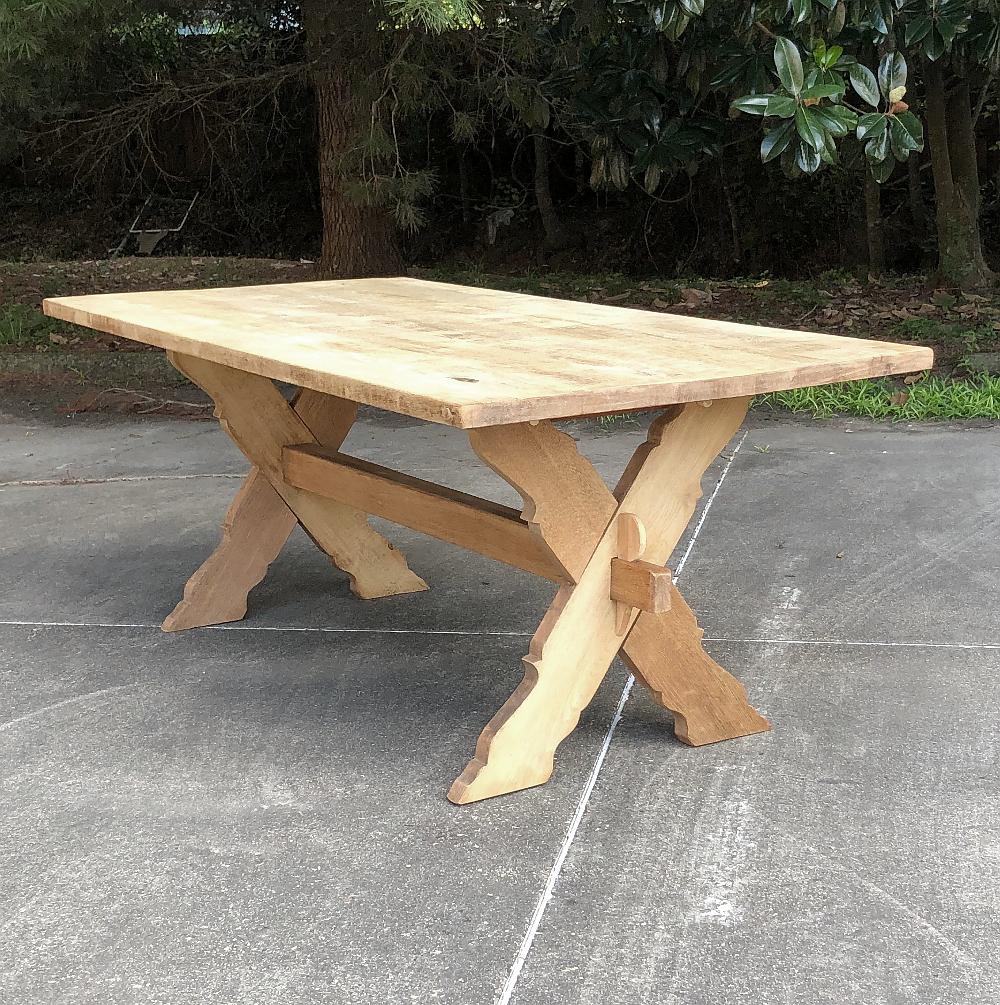 Antique rustic stripped oak trestle table was crafted using time-honoured techniques passed down from generation to generation. 