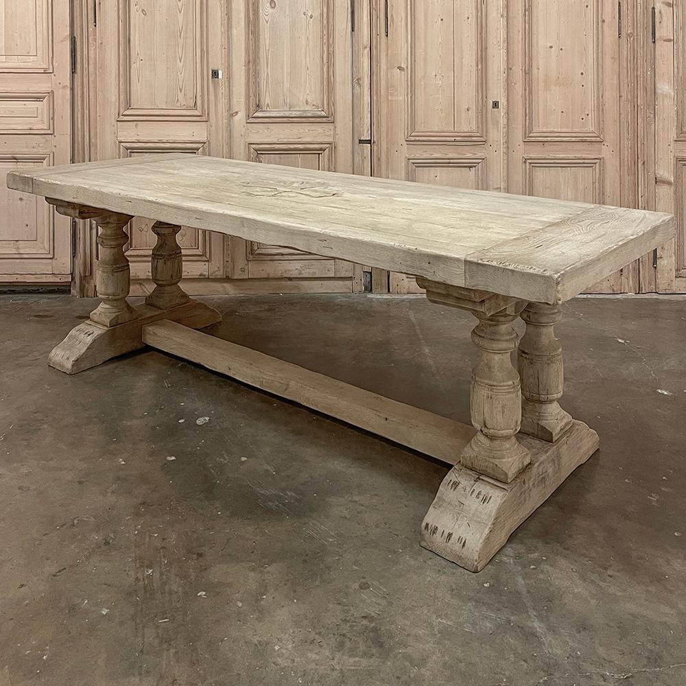 Antique Rustic Stripped Oak Trestle Table was crafted on a grand scale from thick timbers of old-growth oak to literally last for generations!  The thickness of the tabletop is such that a supporting apron is not necessary, providing maximum knee