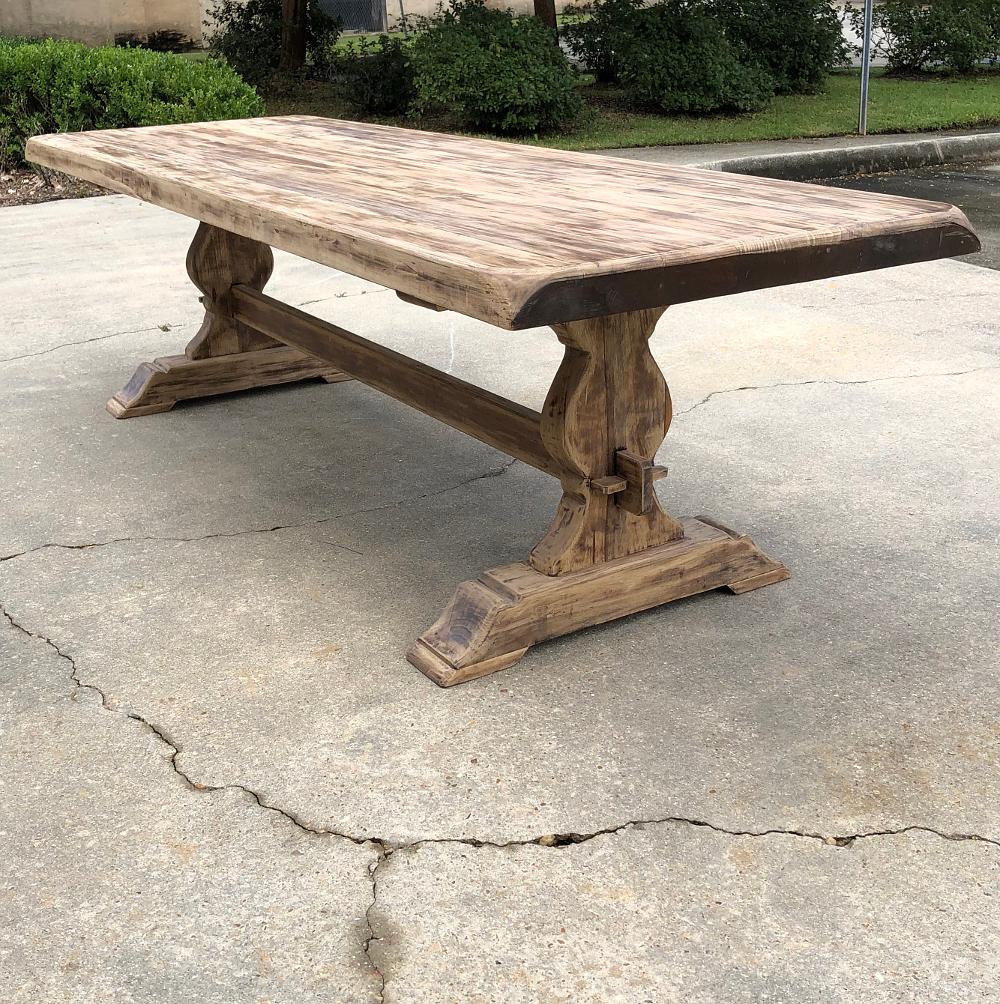 Antique rustic stripped sycamore trestle table is the ideal choice for casual living, with a generous overhang on each end and plenty of legroom underneath thanks to the raised trestle, shimmed in place as has been the custom for talented