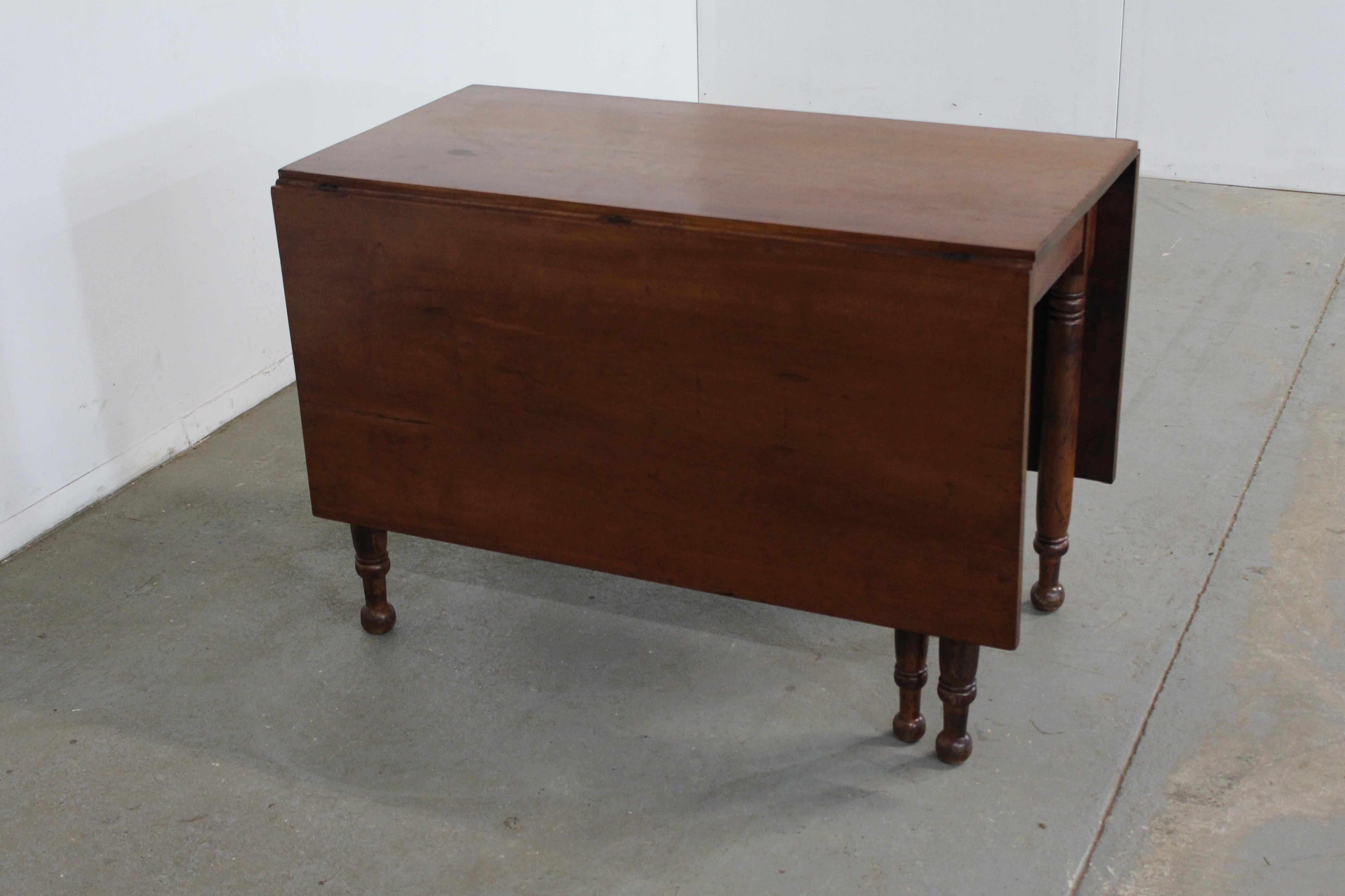 Antique Rustic walnut drop leaf table

Offered is an antique drop leaf table. The table is an excellent of Americana at its finest. Featuring solid Walnut and gate legs. The table can be used with two leaves up or if space is tight it can be pushed