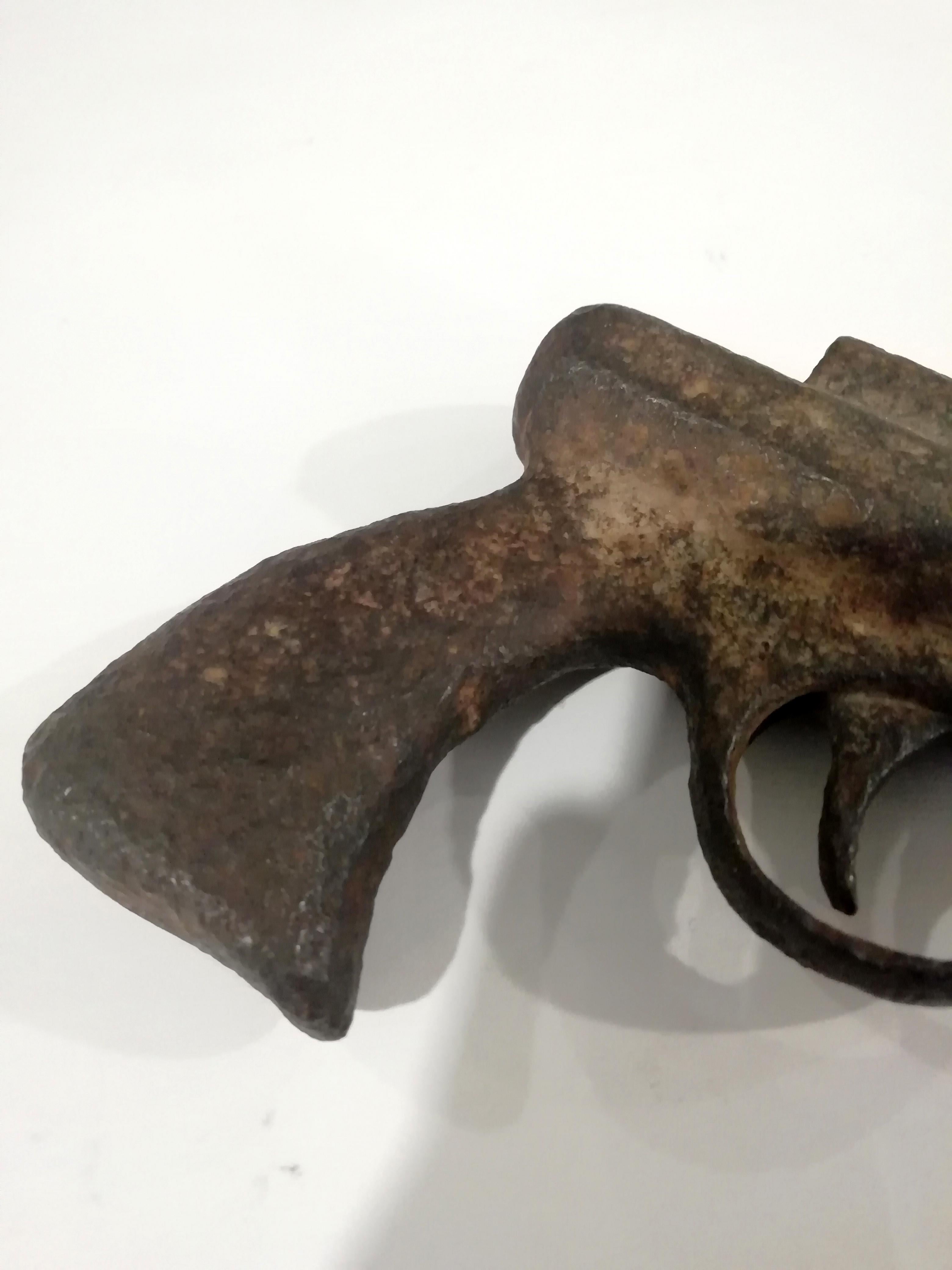 Antique rusty flare gun. The gun is useless and can be used as a paperweight.
