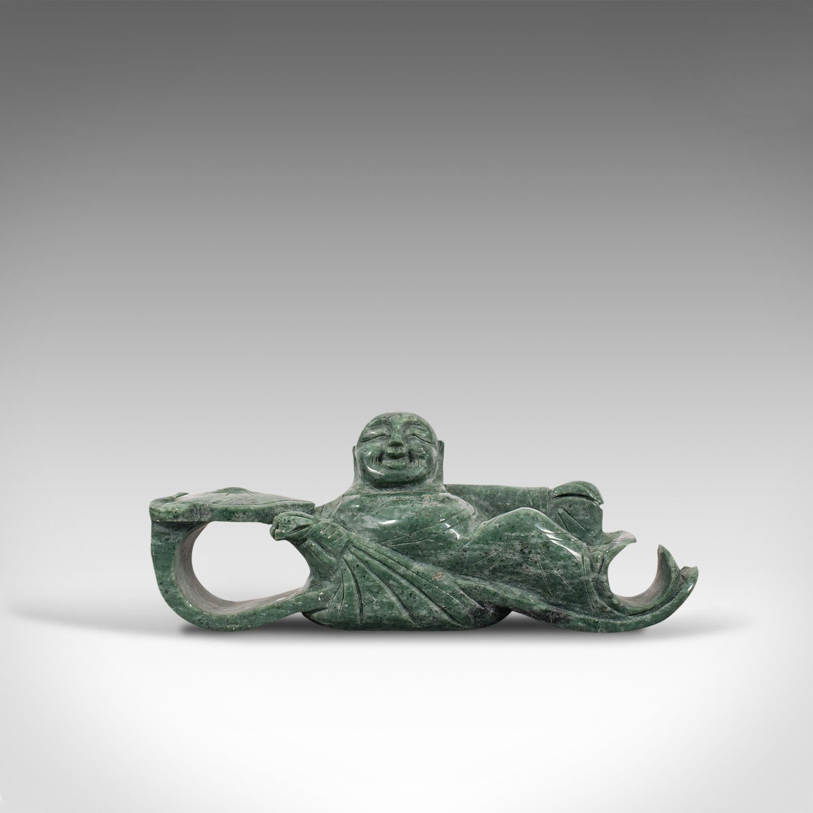 This is an antique Ruyi belt hook. An Oriental, jade marble buckle depicting a reclining Hotei or Budai, dating to the late 19th century, circa 1900.

Pleasingly decorative example of Oriental craftsmanship
Displaying a desirable aged