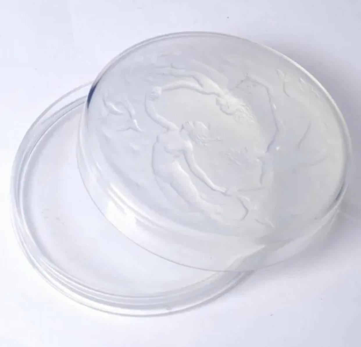 Antique Sabino Opalescent Glass Mermaid Candy Dish C. 1930 10” Diameter.

Sabino opalescent glass Mermaid candy box . 1930 Slightly domed cover depicts 3 mermaids. Marked “Sabino France”. 2” x 10”.

Great condition, some bubbles from manufacturing