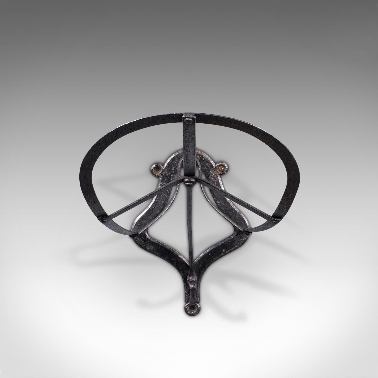 This is an antique saddle rack. An English, cast iron wall mounted equestrian tack rest, dating to the early Victorian period, circa 1850.

An attractive saddle rack as useful today as it was over 150 years ago
Displays a desirable aged patina