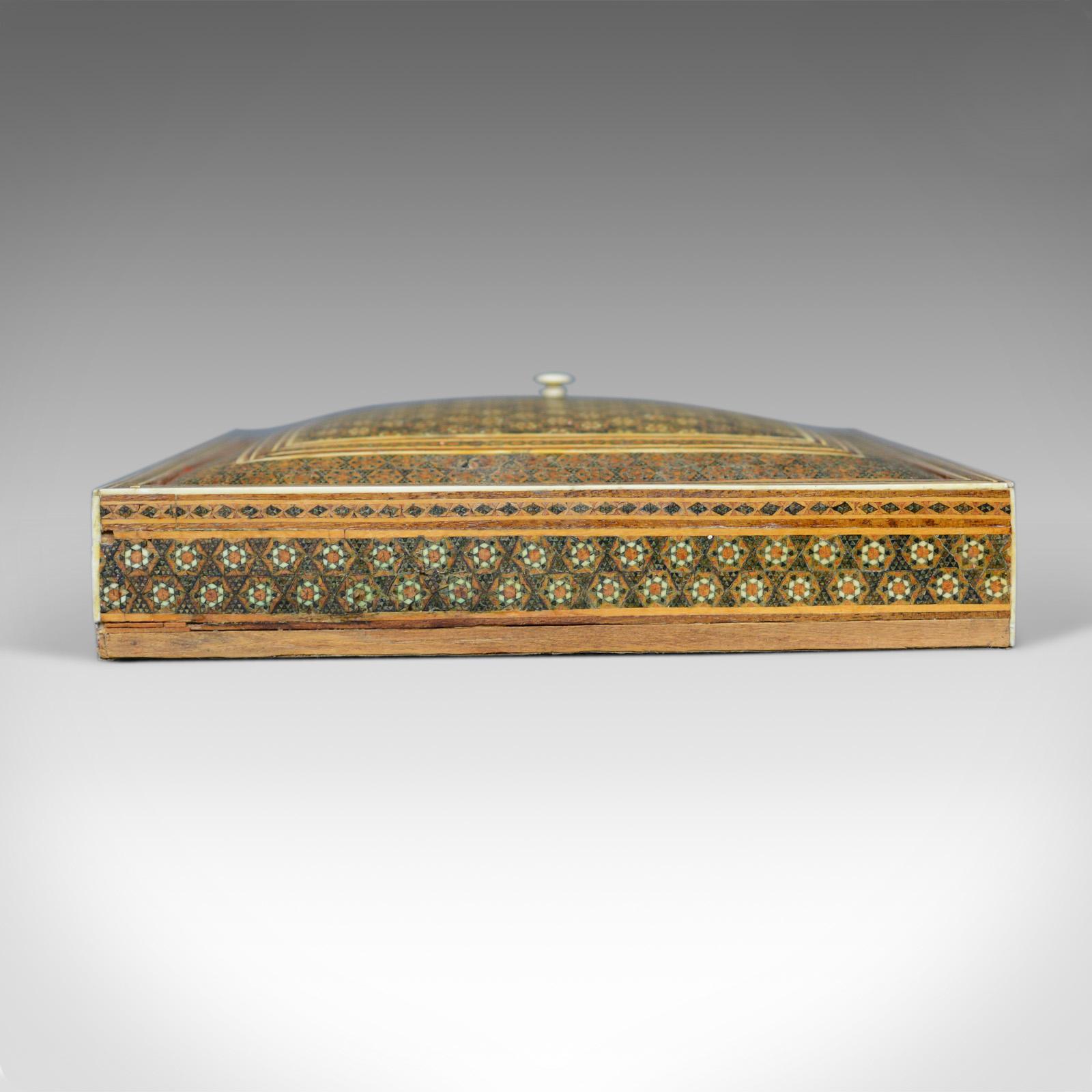 This is an antique Sadeli ware box. An Anglo-Indian jewelry box dating to the late 19th century, circa 1880.

Beautifully crafted Sadeli ware box
Intricate geometric design
In earth tones

The domed lid dressed with a turned pull
Opening to