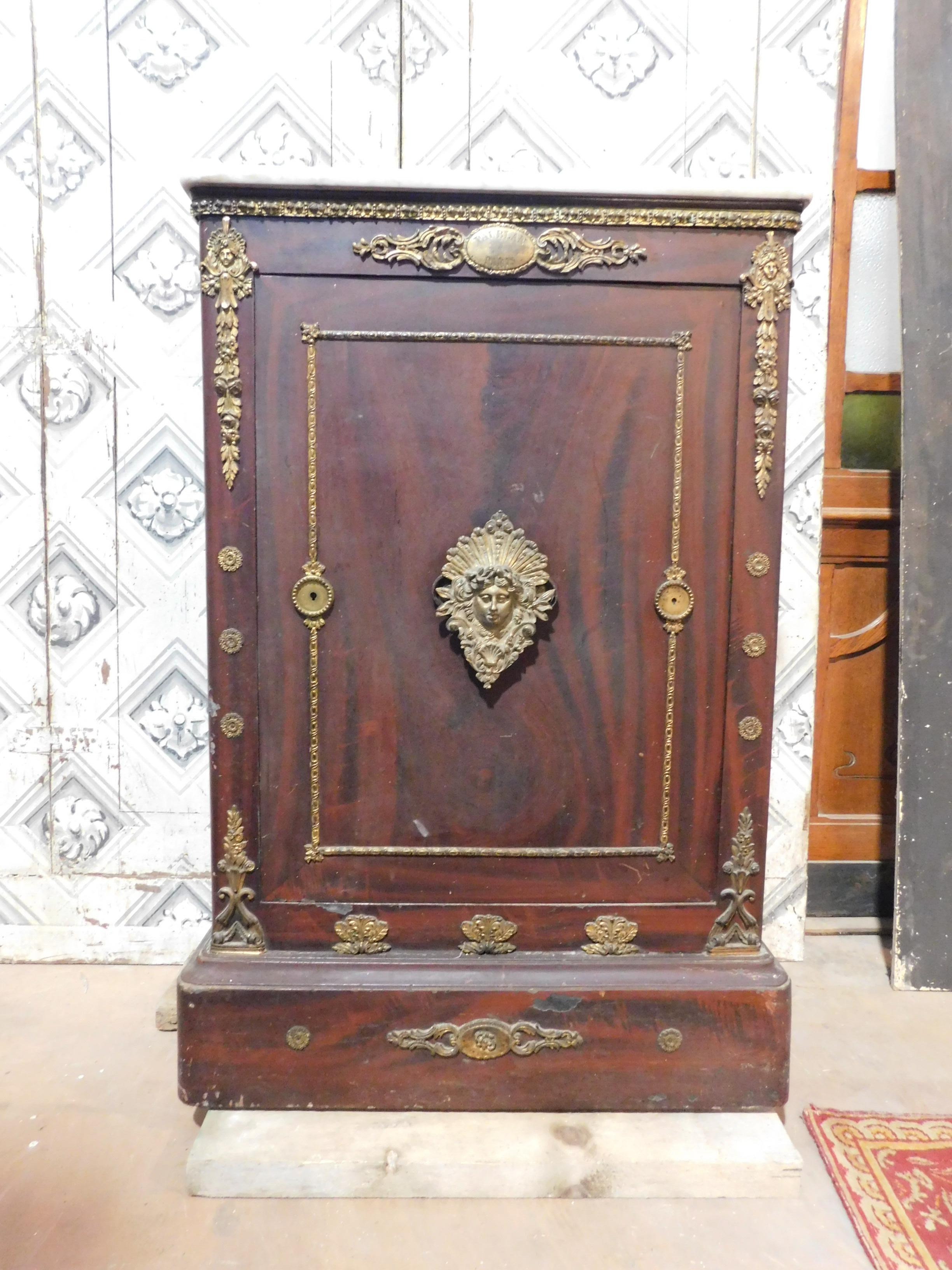 Antique safe in iron lacquered as imitation wood, opening with secret combination, enriched with gilded bronze friezes and upper marble top, trusted interior and blue lacquered with drawer, built in the 19th century in France (Paris), maximum size