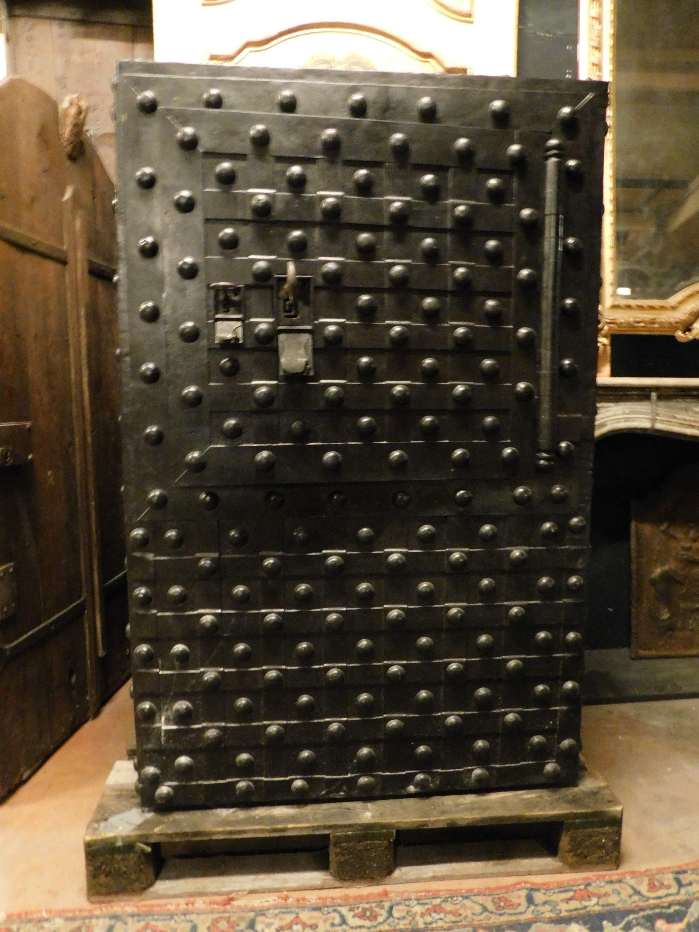 Ancient wooden safe covered in iron, with studs and studded, opens by moving the studs with a secret combination, it still has irons and the original key is from the 1600-1700 era. Beautiful both as a finish and inside, it has a secret trap door