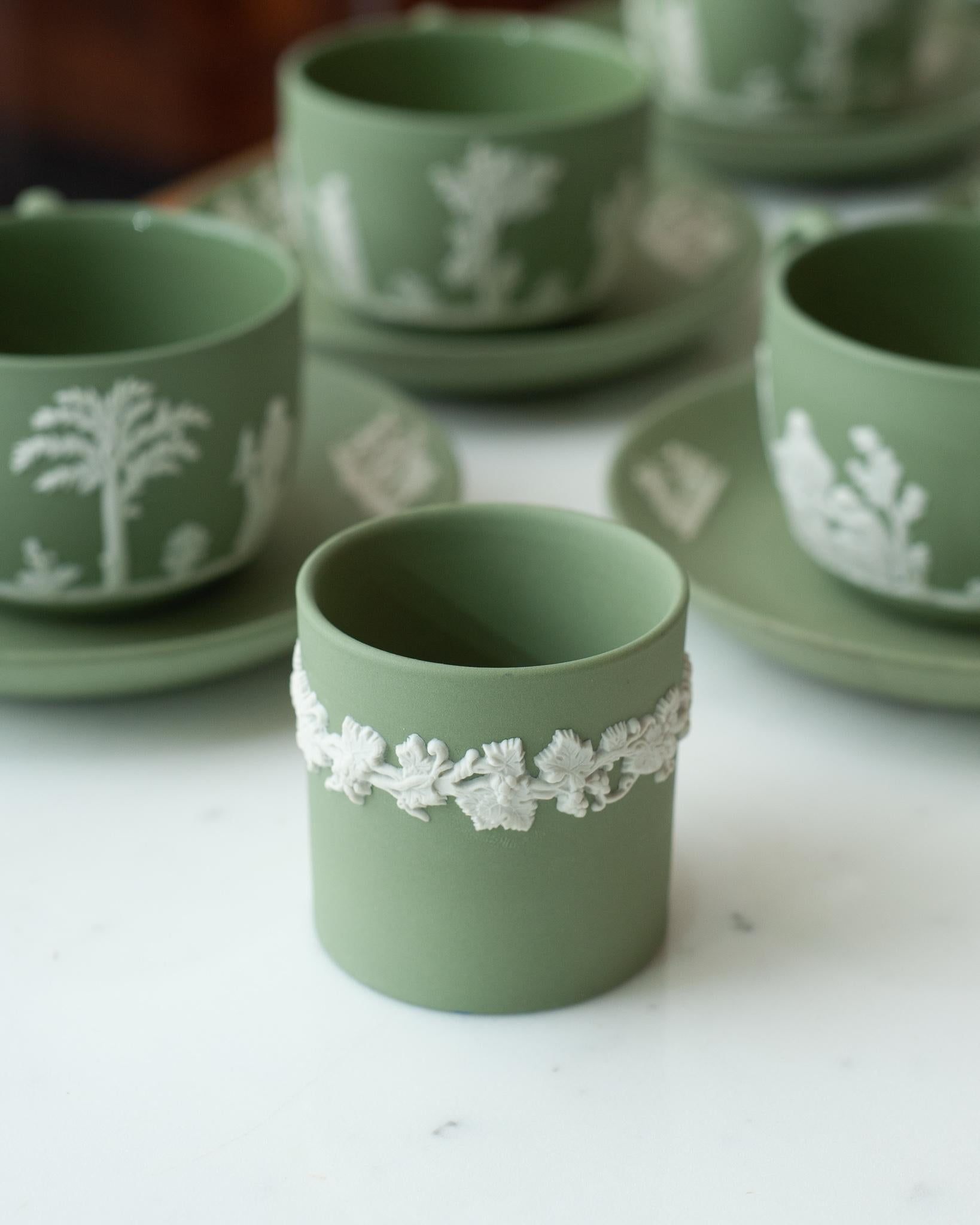 A stunning antique Wedgwood sage green jasperware small cup with white overlay.