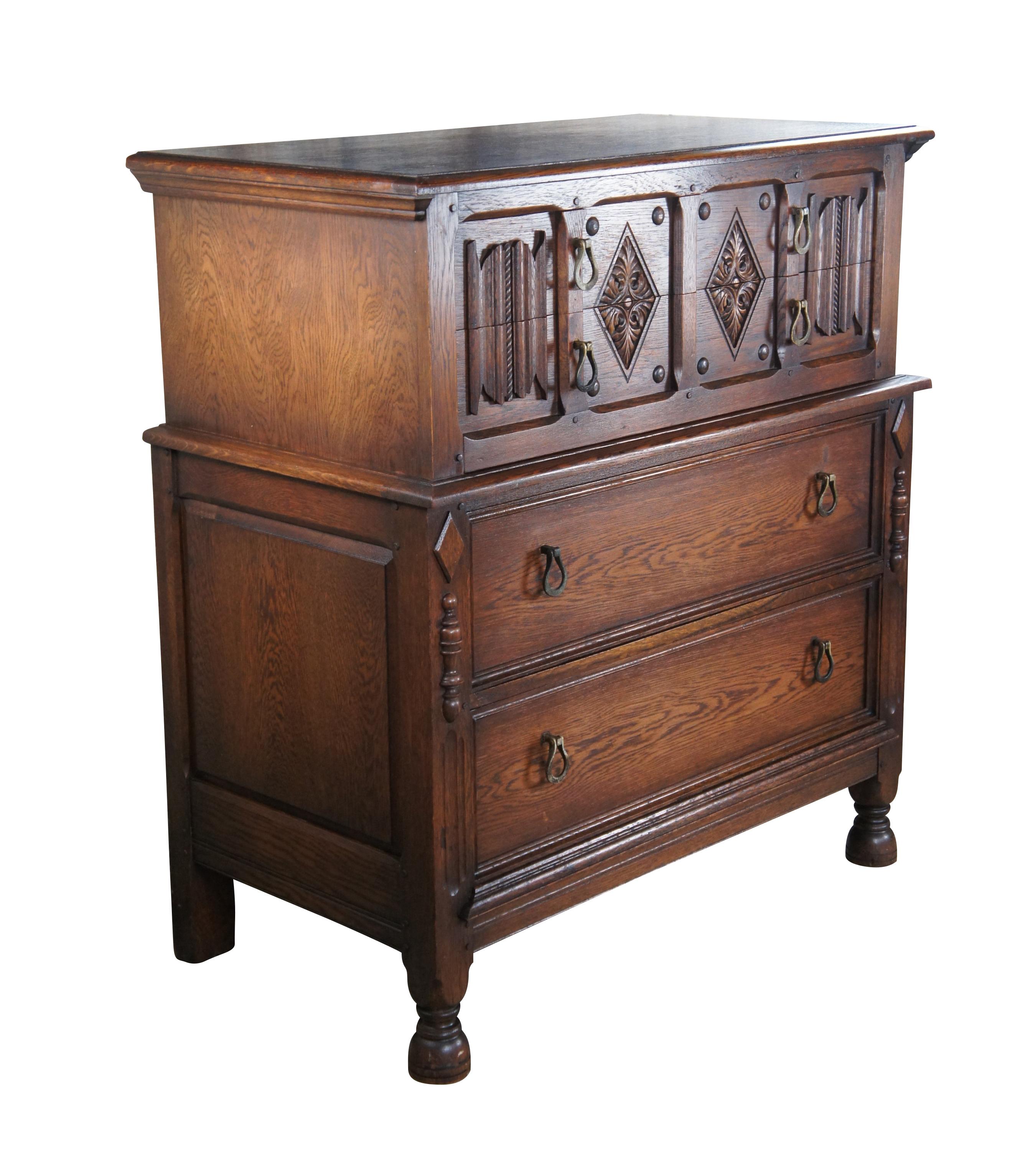 An impressive Spanish Revival chest of drawers by Saginaw Furniture, circa late 1930s to early 40s. Made from oak with four dovetailed drawers.  Features  a rectangular frame with intriguing linen fold and diamond pattern canthus carved accents. 