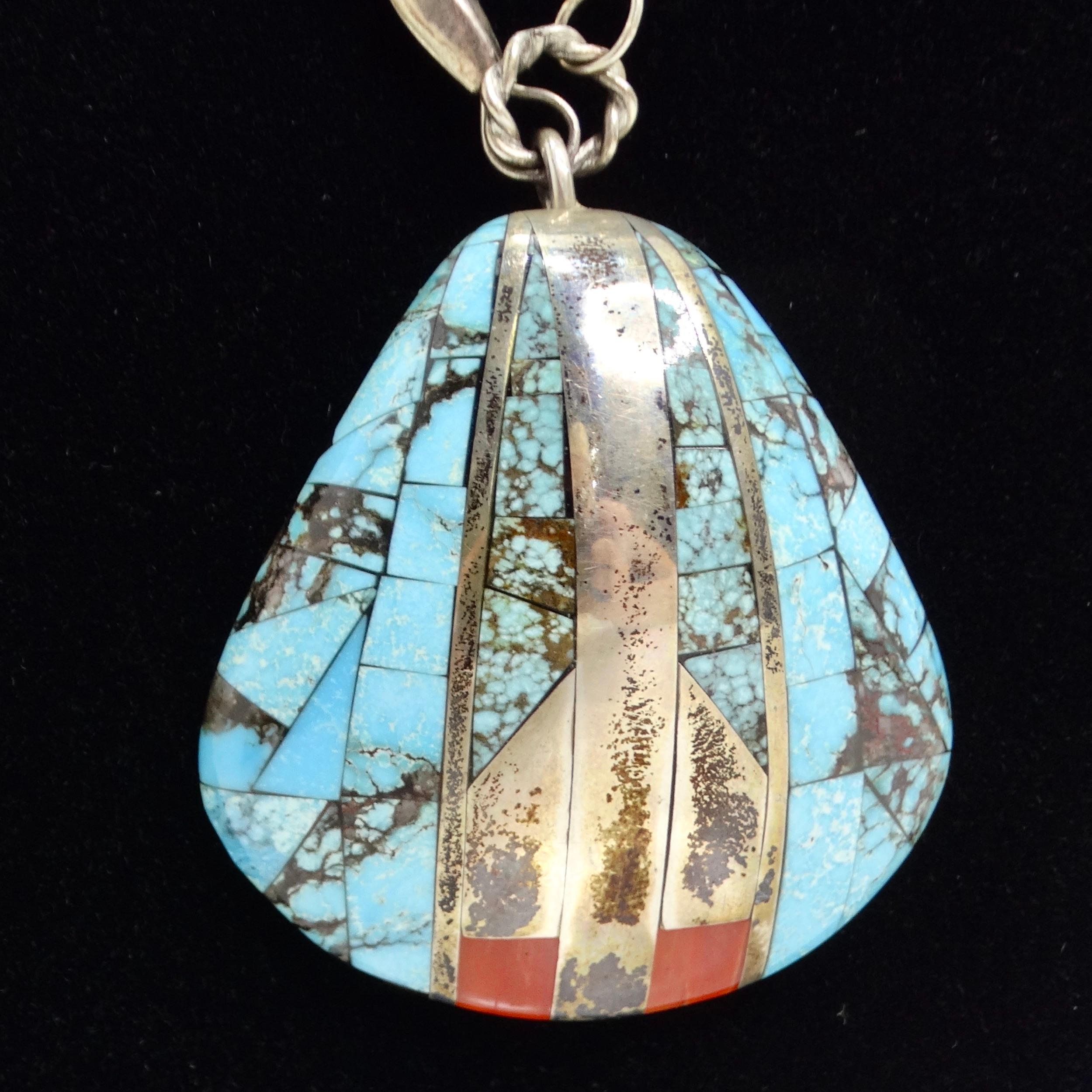 Introducing the Antique Saguaro Traders Turquoise Sea Shell Silver Pendant Necklace, a stunning Native American masterpiece that embodies the beauty and craftsmanship of traditional jewelry. This incredible statement necklace features a pure silver