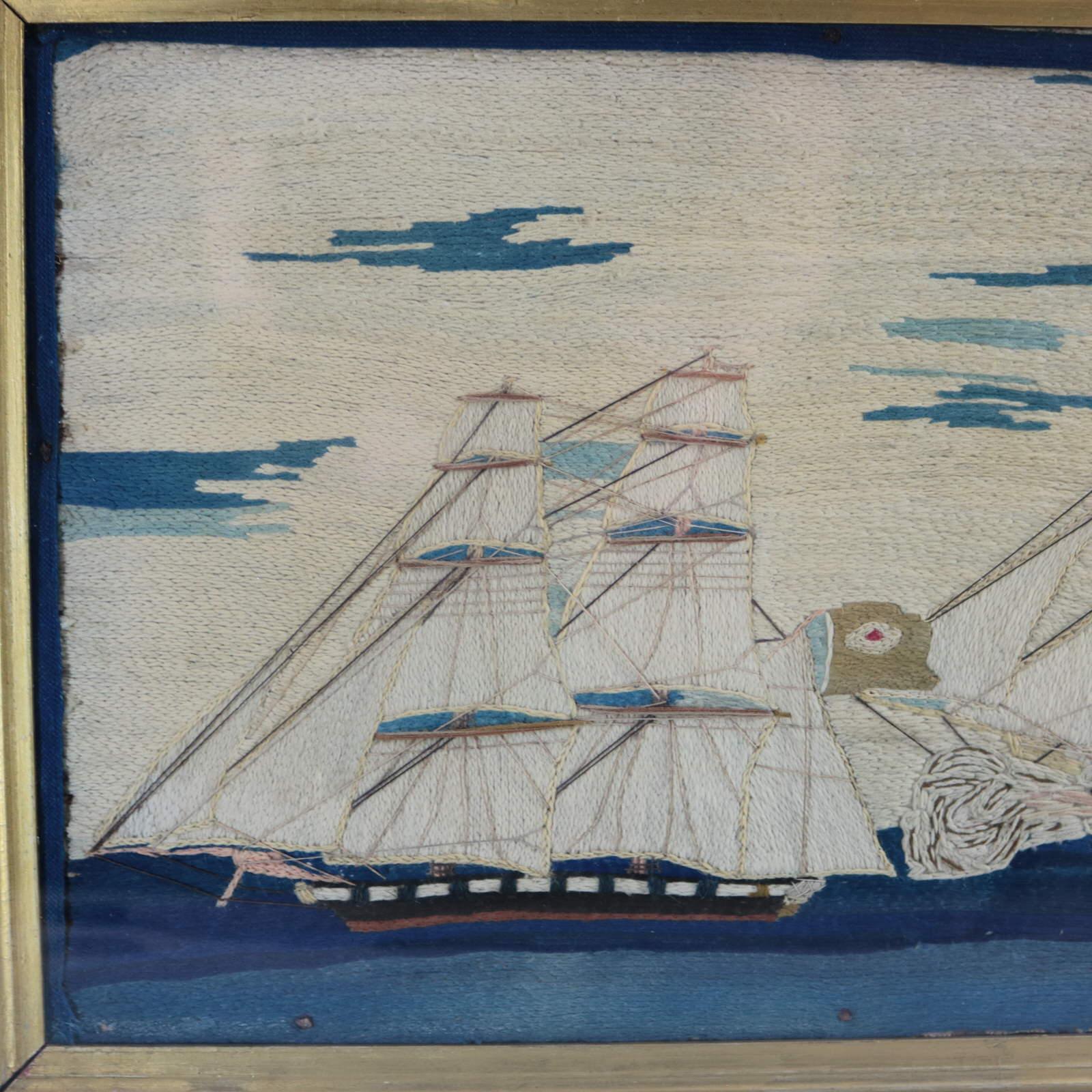 Antique Sailor's Woolwork Embroidery picture of sailing ship in pursuit of and firing on another. The embroidery is worked in wool on canvas ground, blue ribbon border, a variety of stitches, raised work canon fire, and thread rigging. Colours