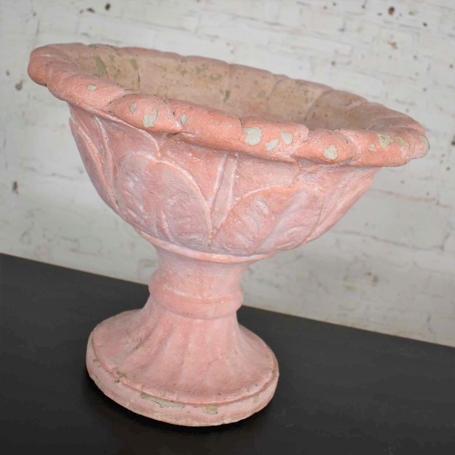 Awesome antique concrete garden urn or planter. This salmon colored paint encrusted urn is in fabulous vintage condition with lots of gorgeous natural age patina. Please see photos, circa 20th century.

This incredible antique garden urn should be