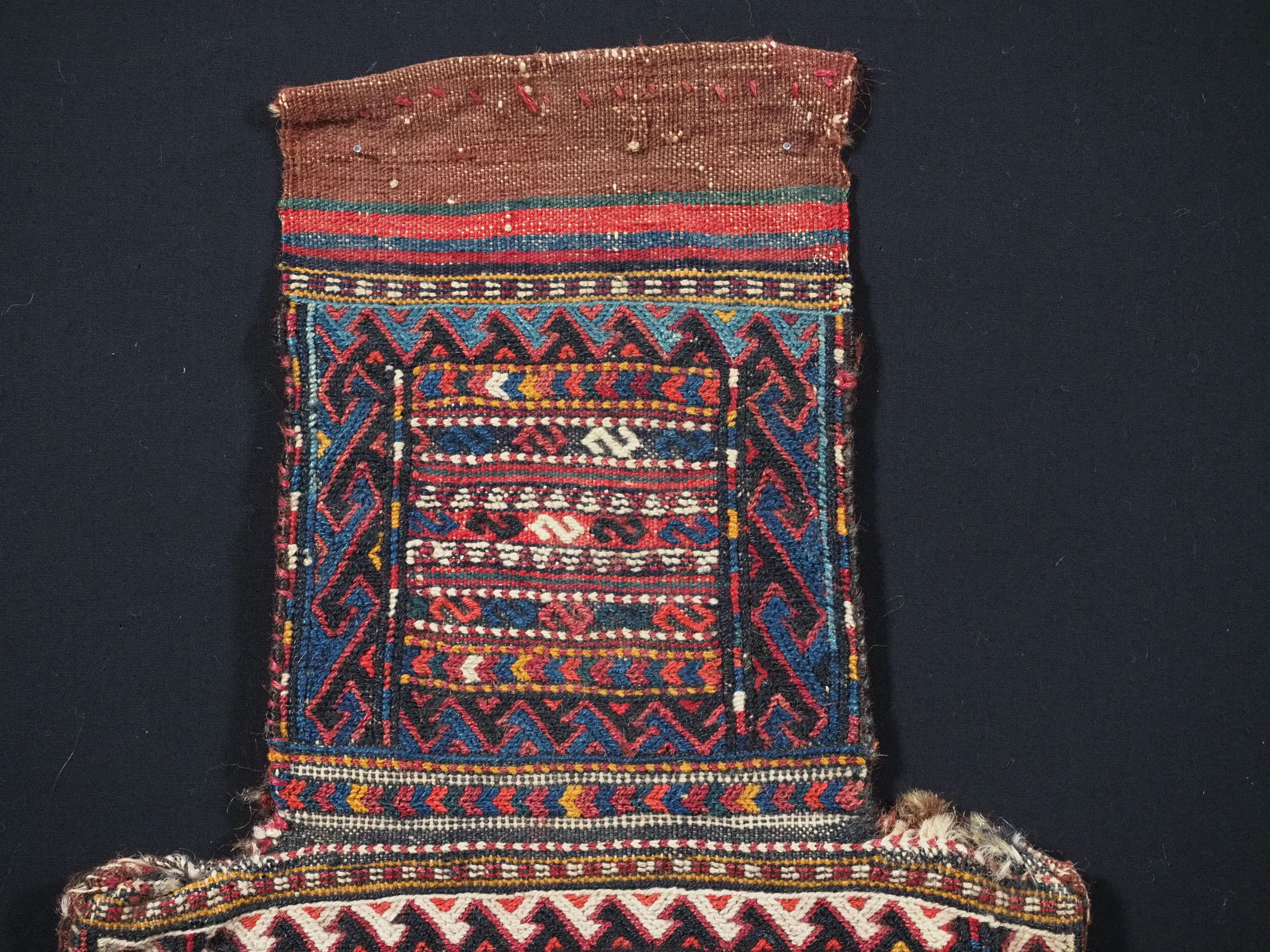 
Size: 1ft 8in x 1ft 1in (52 x 33cm).

Antique salt-bag by the Quchan Kurd nomads of north-east Persia.

Circa 1900.

This is a superb example of Kordi salt-bag in soumak work with a finely detailed banded design. The salt-bag has a wonderful array