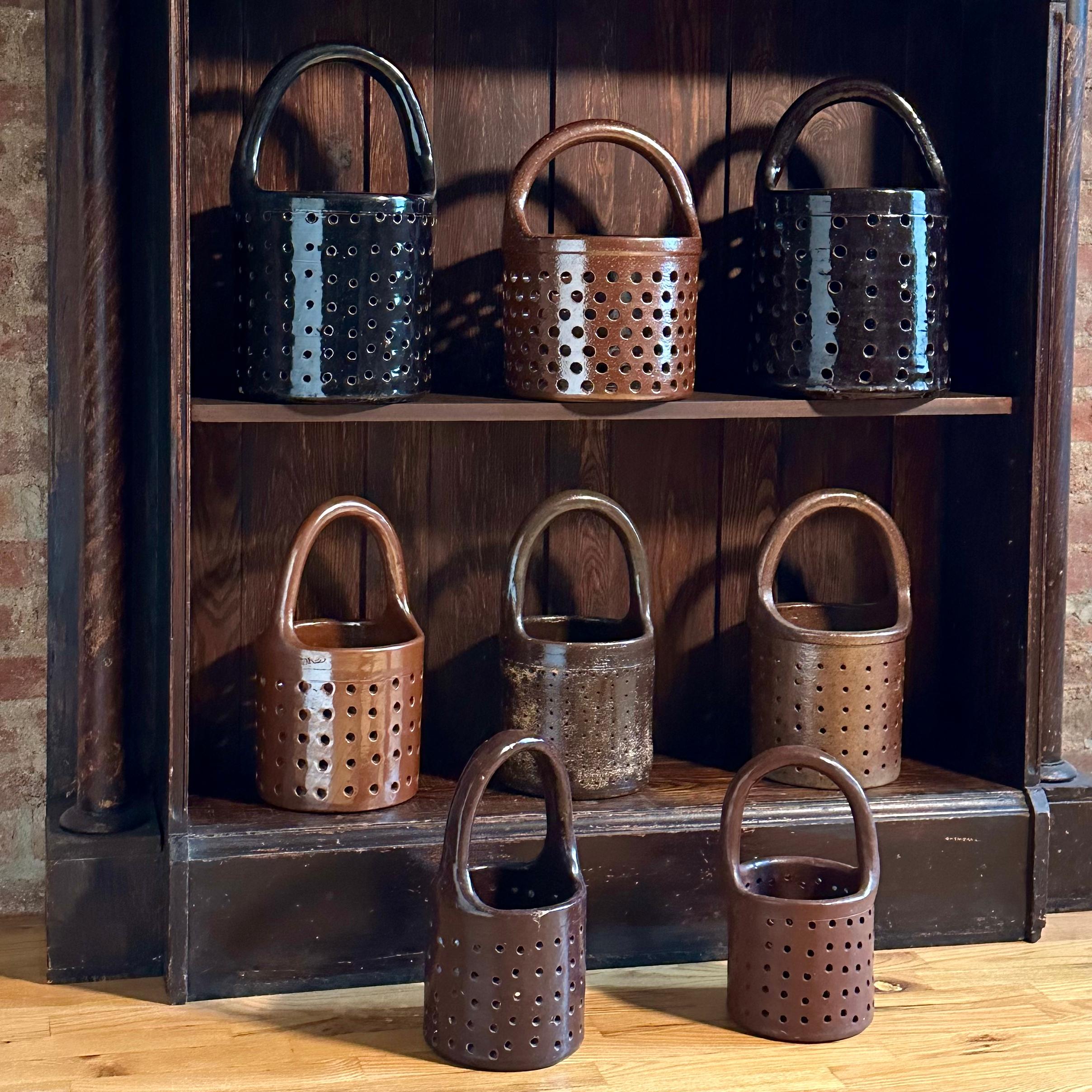 *Please visit our storefront for additional baskets.

SOLD INDIVIDUALLY: A collection of antique stoneware dipping baskets once used by plating factories to contain tarnished metal articles as they were submerged in acids in order to be stripped.