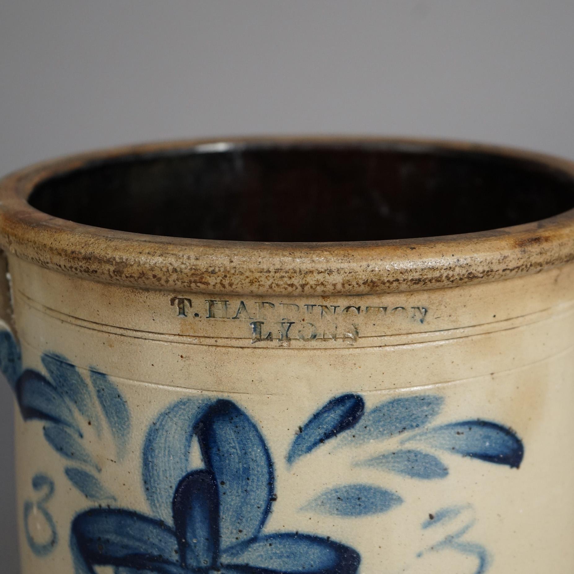 An antique T. Harrington Lyons crock offers salt glazed stoneware construction with double handles and blue decorated with stylized floral design, maker stamp as photographed, c1870

Measures - 10.5