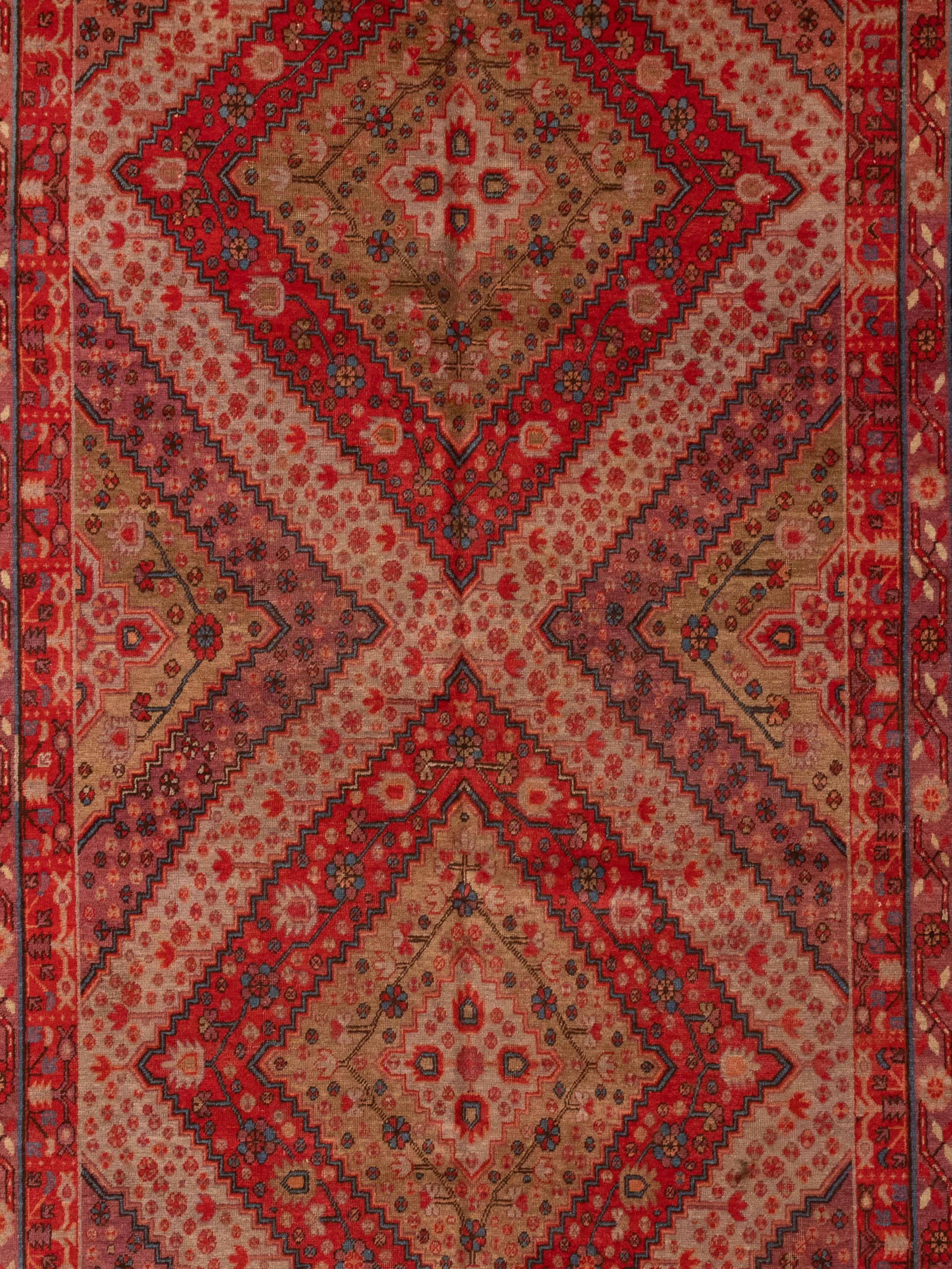This is an antique Samarkand rug from east Turkistan. Samarkand rugs can be distinguished from other rugs through their style, which is an amalgamation of techniques from the west to China. 

The central design of this Samakand rug is two stylized