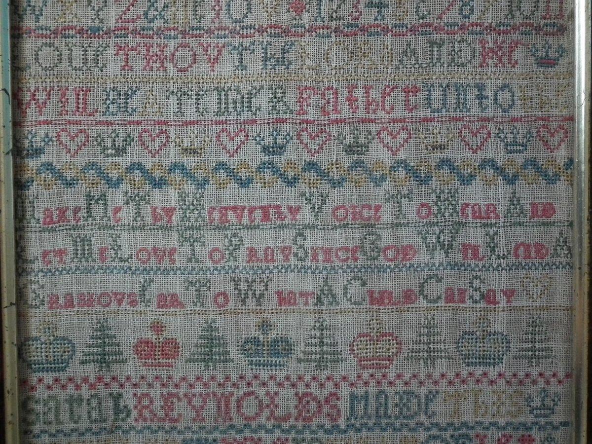 Antique sampler, 1735, Sarah Reynolds. The sampler is worked in silk on linen ground, in cross stitch and Algerian eye. No border, divider lines in various patterns. Colors red, green, yellow and blue. Alphabets A-Z in upper case and numbers 1-11.