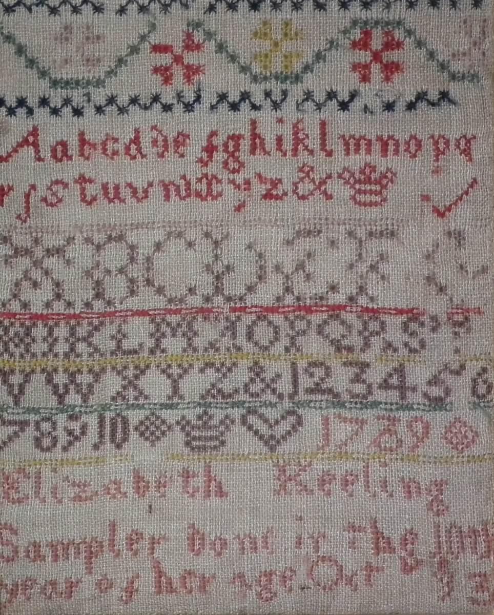 1739 Sampler by Elizabeth Keeling. The sampler is worked in Fine wool on canvas ground, in a variety of stitches including Algerian eye. No border, divider lines in various patterns. Colors pinks, red, yellow, green, purples and blues. Alphabets A-Z