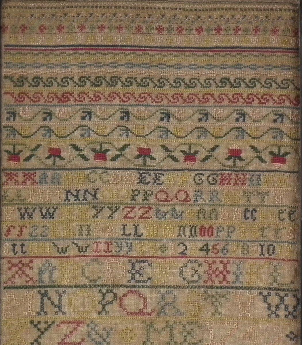 Antique Sampler, 1742 Verse sampler by Mary Ellicott. The sampler is worked in silk on linen ground, in cross stitch and Algerian eye. No border, divider lines in various patterns. Colors red, cream, yellow, pink, greens and blues. Alphabets A-Z in