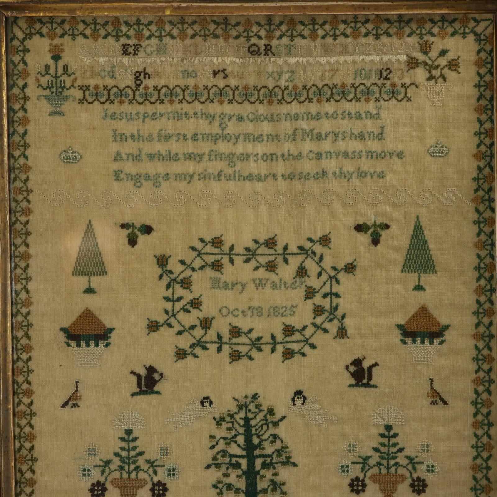 Regency Sampler, 1825, by Mary Walter. The sampler is worked in silk threads on a linen ground, mainly in cross stitch. Meandering strawberry border. Colours green, dark brown, white, blue and gold. Alphabets A-Z in upper case and lower case and