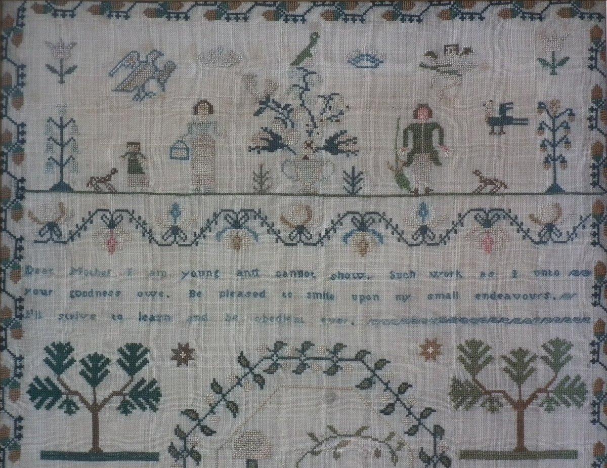 1834 Sampler by Ann Jones. The sampler is worked in silk on linen ground, in a variety of stitches. Meandering strawberry border. Colors pink, green, dark brown, copper, white, pale blue and cream. Verse reads, 'Dear Mother I am young and cannot