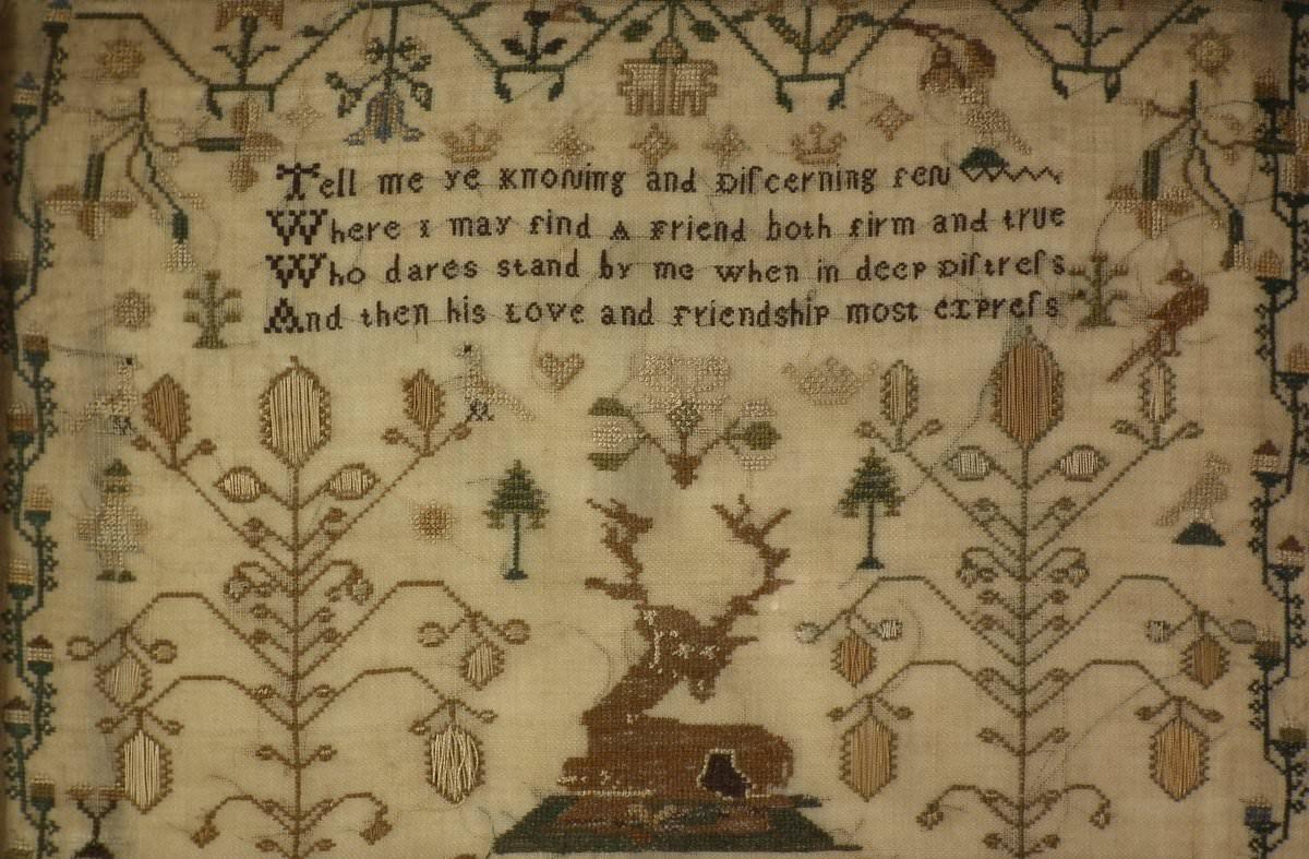 Antique Sampler, circa 1832, by Sarah Ann Davies. The sampler is worked in silk on linen ground, in a variety of stitches. Meandering strawberry border. Colors greens, cream, yellow, pale blue, gold, browns and black. Verse reads, 'Tell me ye