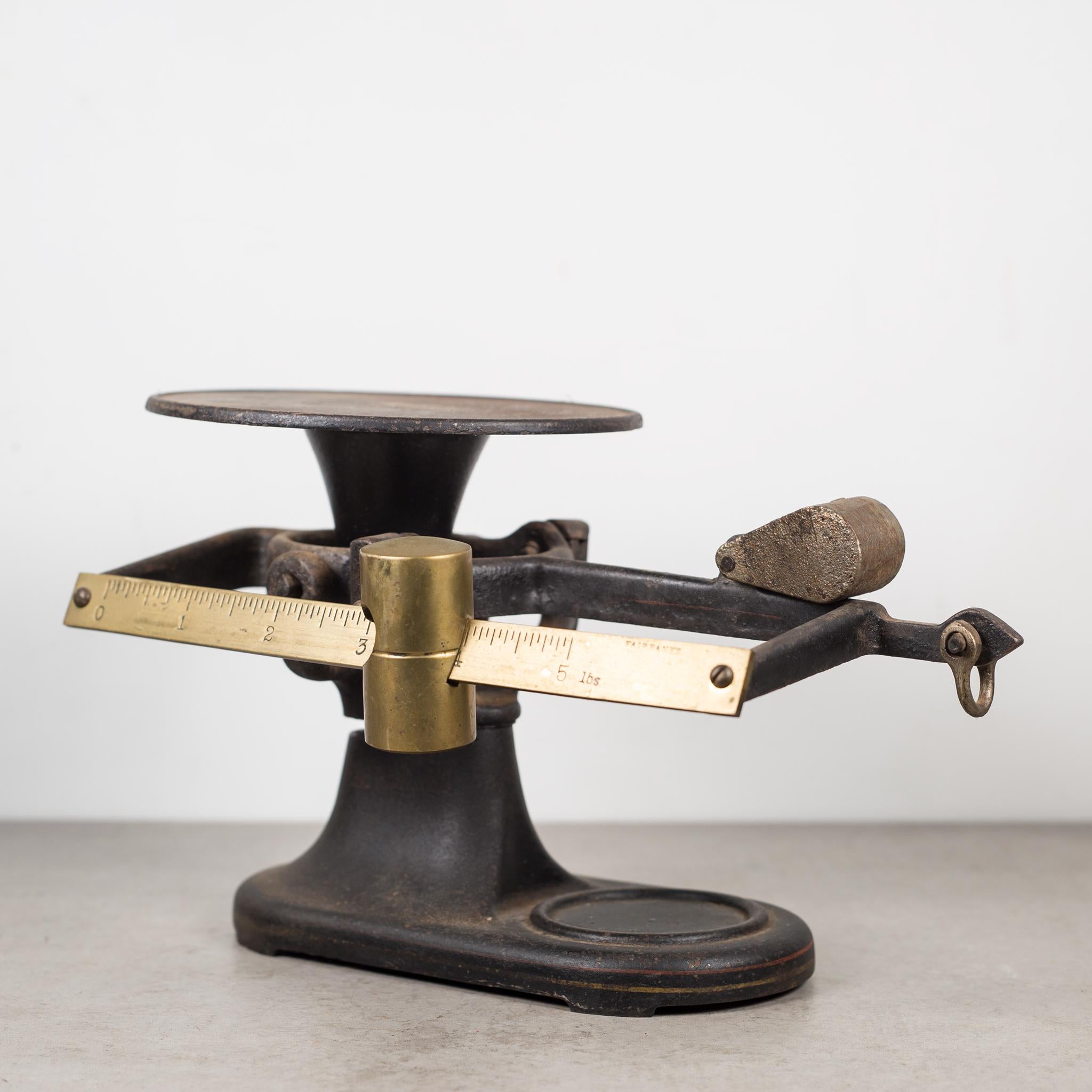 About

A cast iron balance scale with original label, brass accents and 