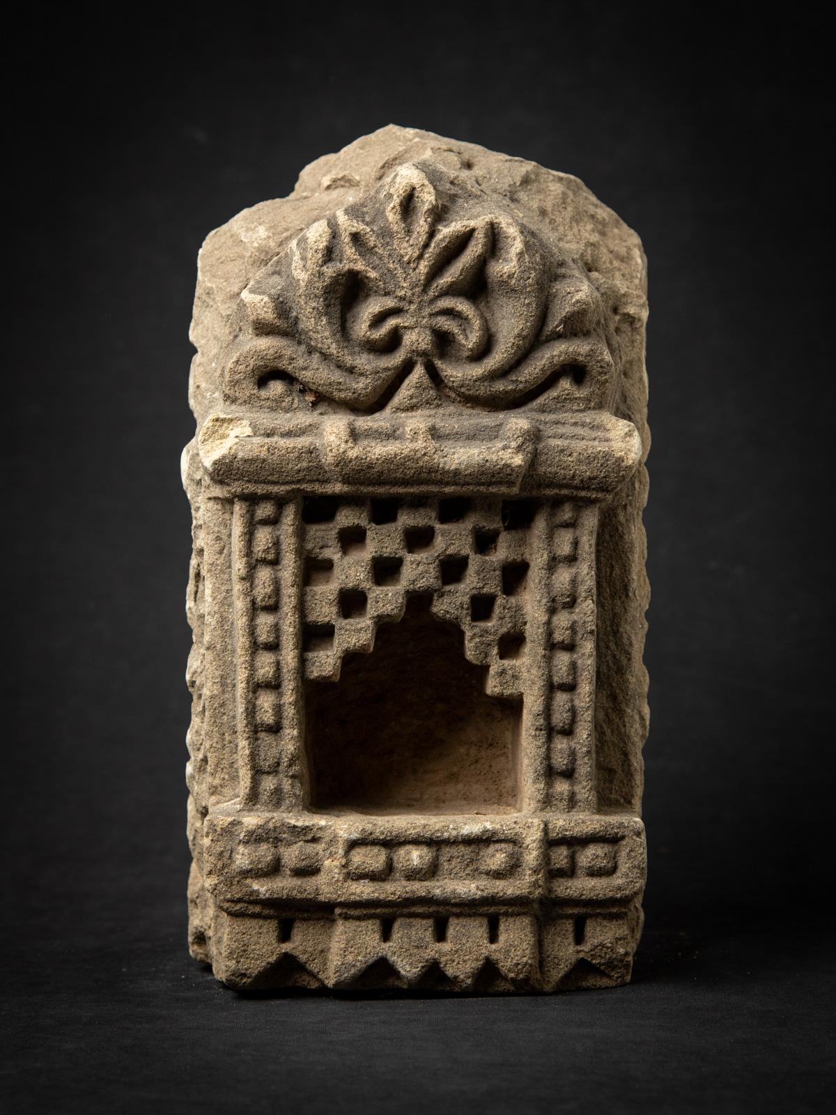 Introducing this antique sandstone Indian temple, a captivating 19th-century piece that embodies the artistry and spiritual heritage of India. Made from robust sandstone, it stands 37 cm high with a width and depth of 19.5 cm, and weighs 22.9 kg,