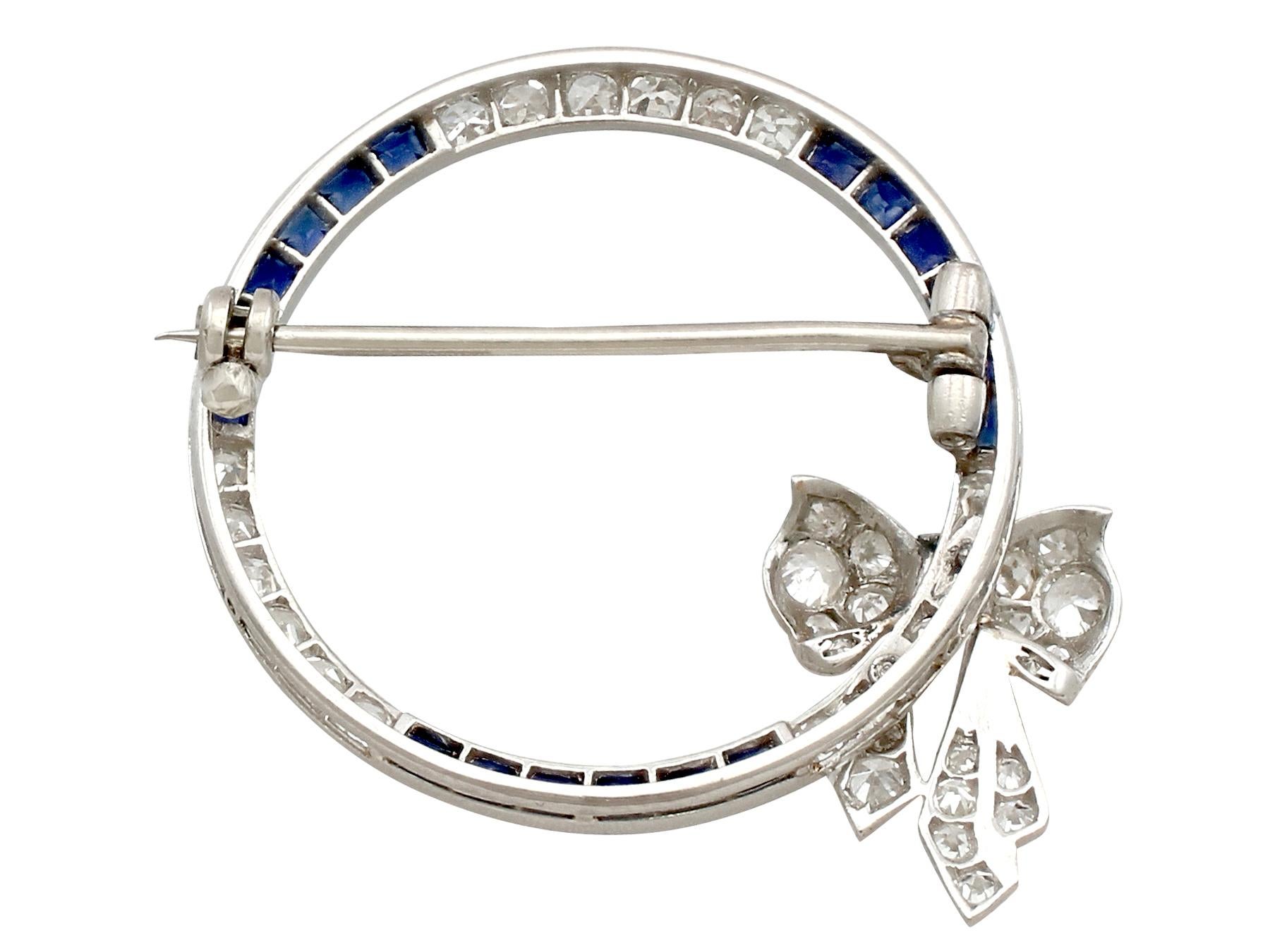 Antique Sapphire and 1.27 Carat Diamond Platinum Bow Brooch, circa 1910 1