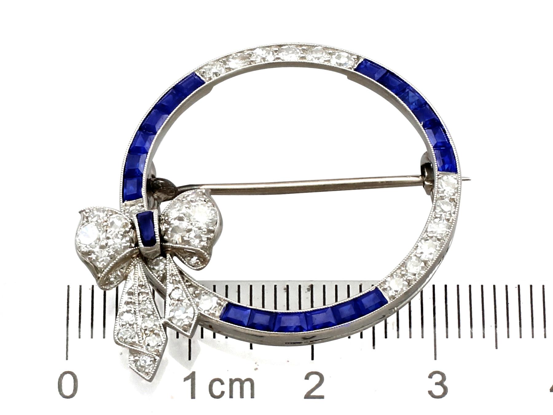 Antique Sapphire and 1.27 Carat Diamond Platinum Bow Brooch, circa 1910 3