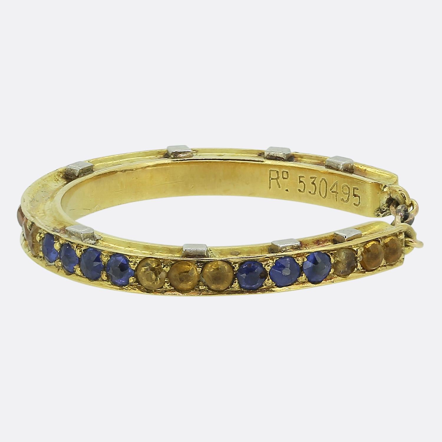 Here we have a wonderfully unique ring taken from the later stages of the Victorian period. This antique piece has been crafted from a rich 18ct yellow gold and features a highly detailed under-gallery exhibiting vivid navy blue and yellow enamel