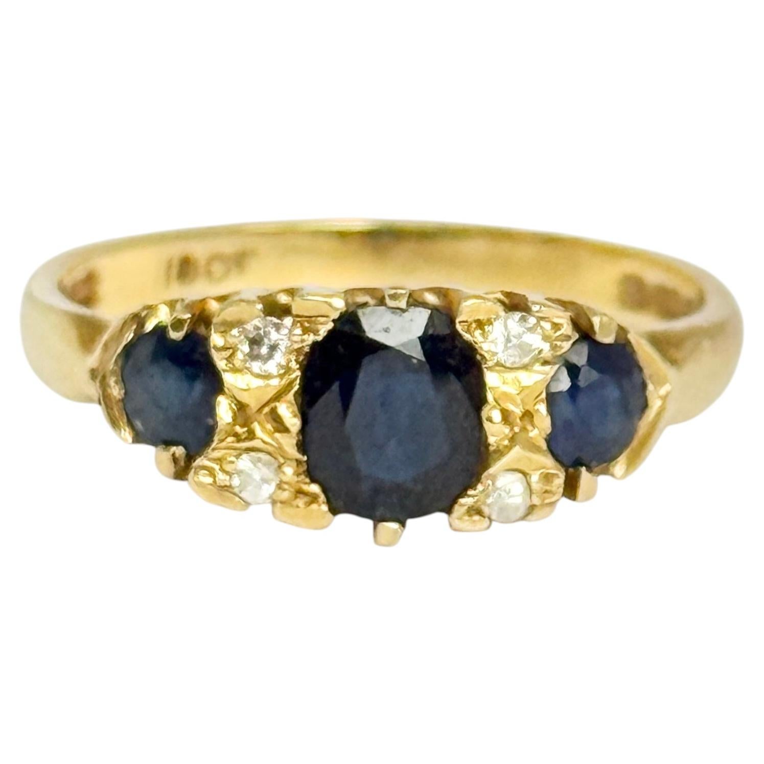 Anello antico a tre pietre con zaffiro e diamante in oro 18 carati