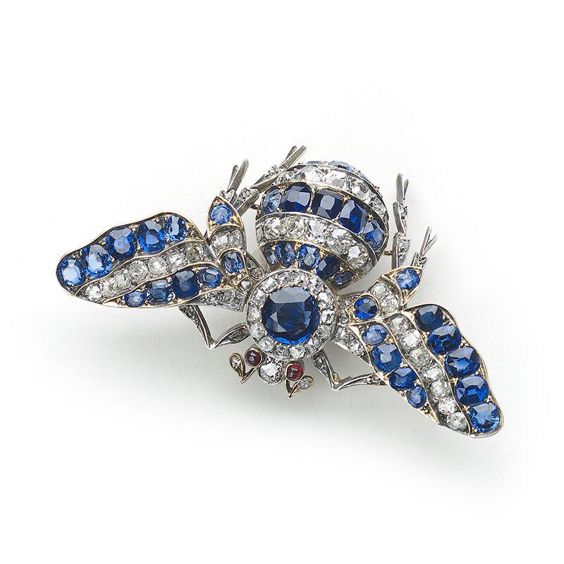 An antique, sapphire and diamond bee brooch, set with old-cut diamonds and sapphires, with cabochon rubies for the eyes, mounted in silver-upon-gold. English, circa 1880.