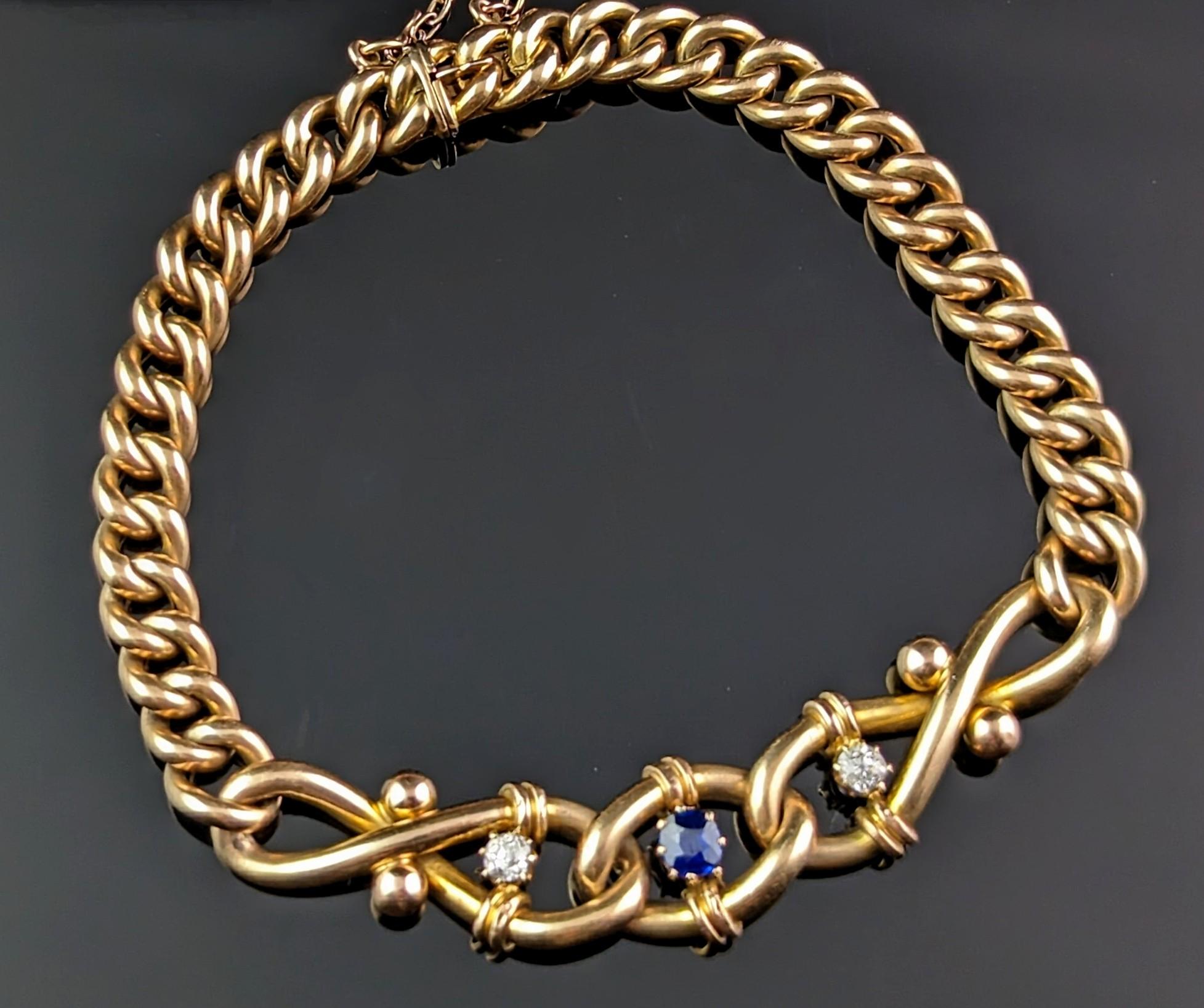 You will fall in love with this impeccable antique, Art Nouveau era, 15kt gold Sapphire and Diamond bracelet.

This fine bracelet is certainly a very high quality piece, it has a decorative twist or knot design to the front, set with two sparkling