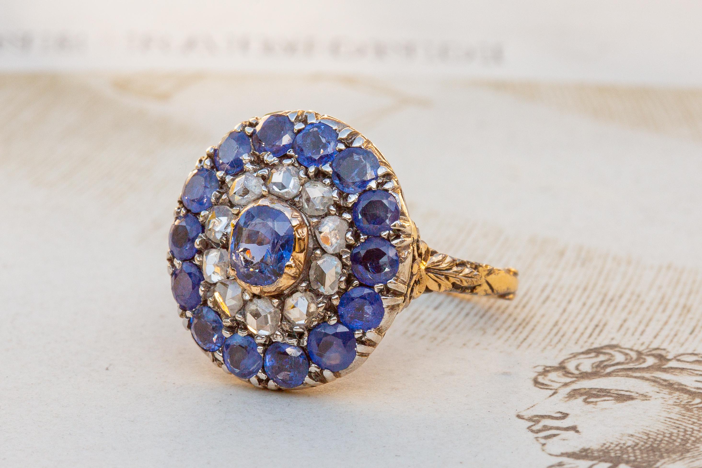 A gorgeous antique sapphire and rose cut diamond cluster ring. This usual example is made in Georgian style, however would have actually been made in Holland in the first half of the 20th century. The Netherlands produced expertly crafted