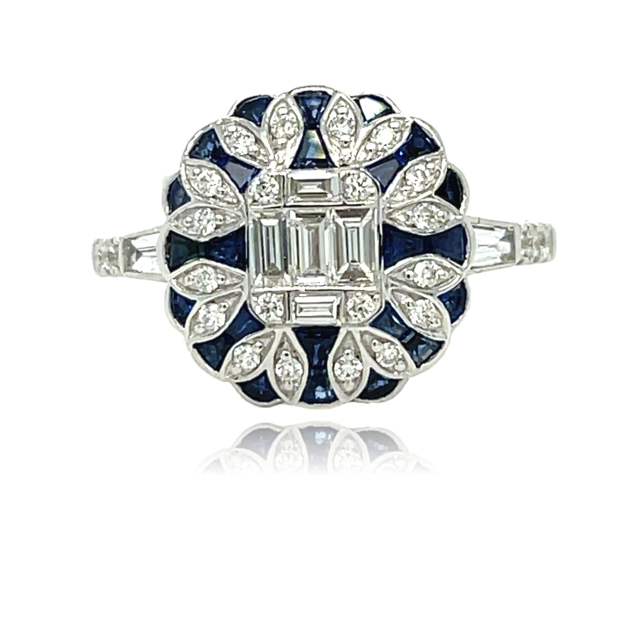 This stunning ring has natural Sapphire and Diamonds set in 18 karat white gold. There are sparkling tapered and round diamonds on the shank for a delicate accent. This ring will be shipped in a beautiful box, ready for the perfect gift! The ring is