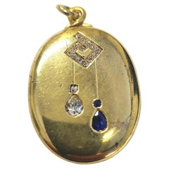 Pendentif médaillon russe ancien en or avec saphir et diamants