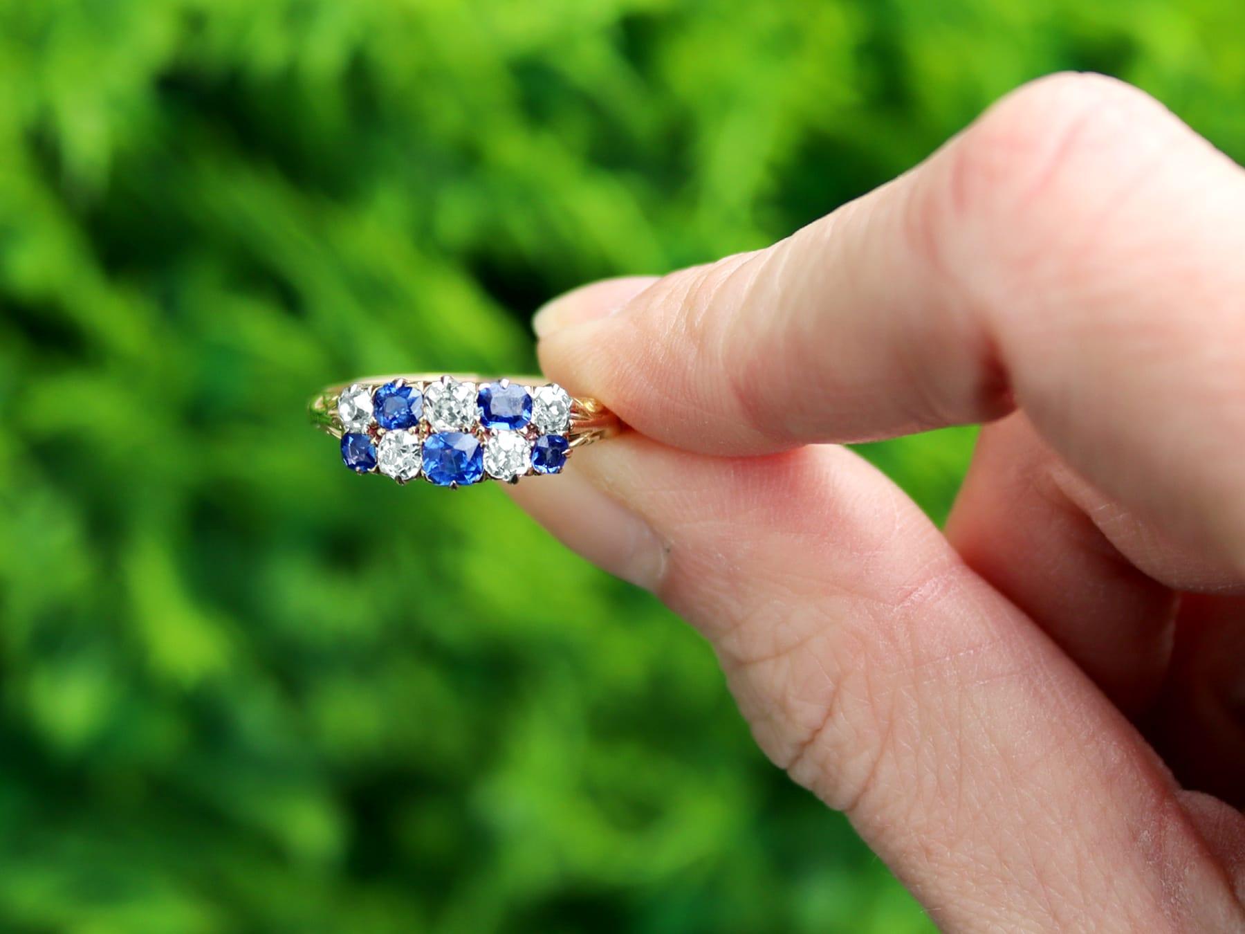 A fine and impressive antique 0.80 carat blue sapphire and 0.62 carat diamond, 18 karat yellow gold dress ring; part of our antique jewelry and estate jewelry collections.

This fine and impressive antique Victorian ring has been crafted in 18k