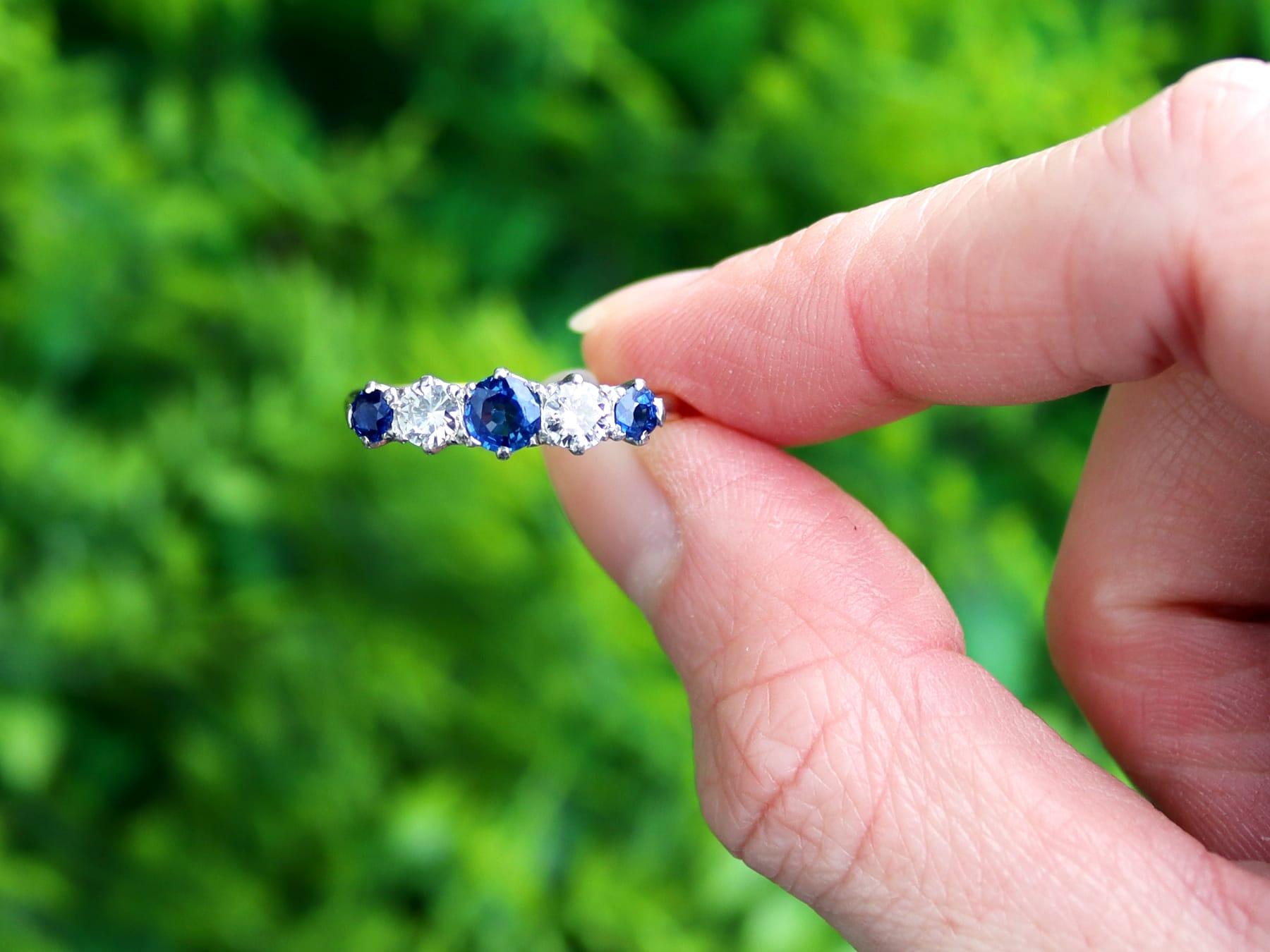 A fine and impressive antique 0.59 carat blue sapphire and 0.45 carat diamond, 18 karat yellow gold and platinum set five stone dress ring; part of our diverse antique jewellery and estate jewelry collections.

This fine and impressive sapphire and