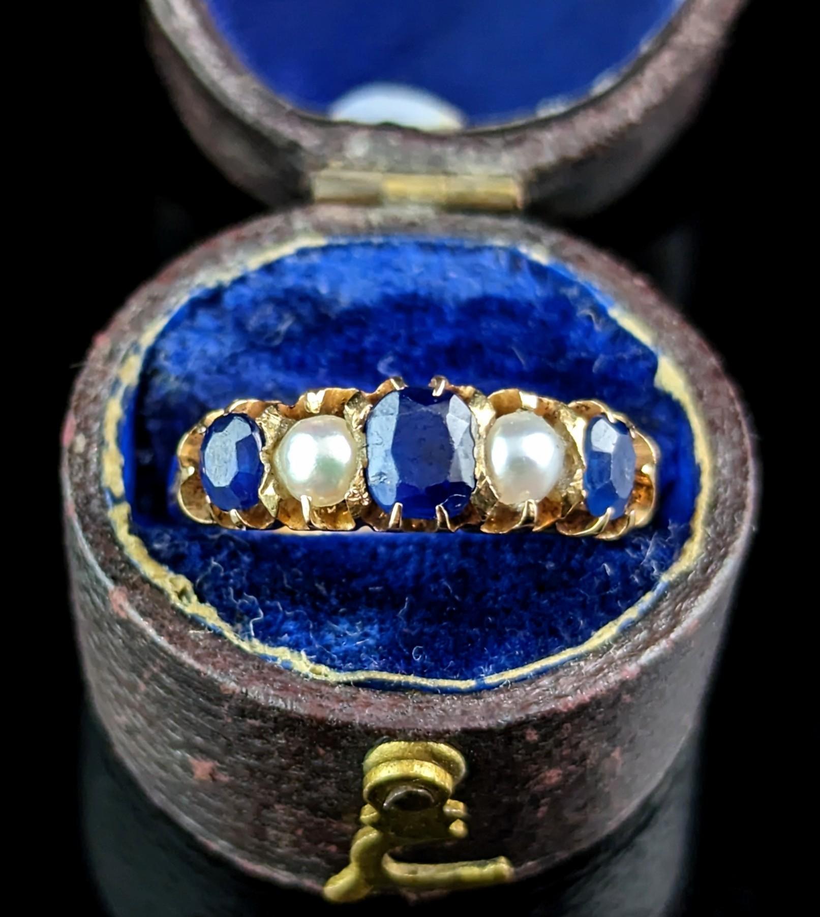 The Glorious Sapphires in this magnificent antique ring really are the showstoppers of this piece.

Such a beautiful and rich deep blue, a royal blue in a ring fit for a princess, the ring features three blue sapphires and two split pearls.

The