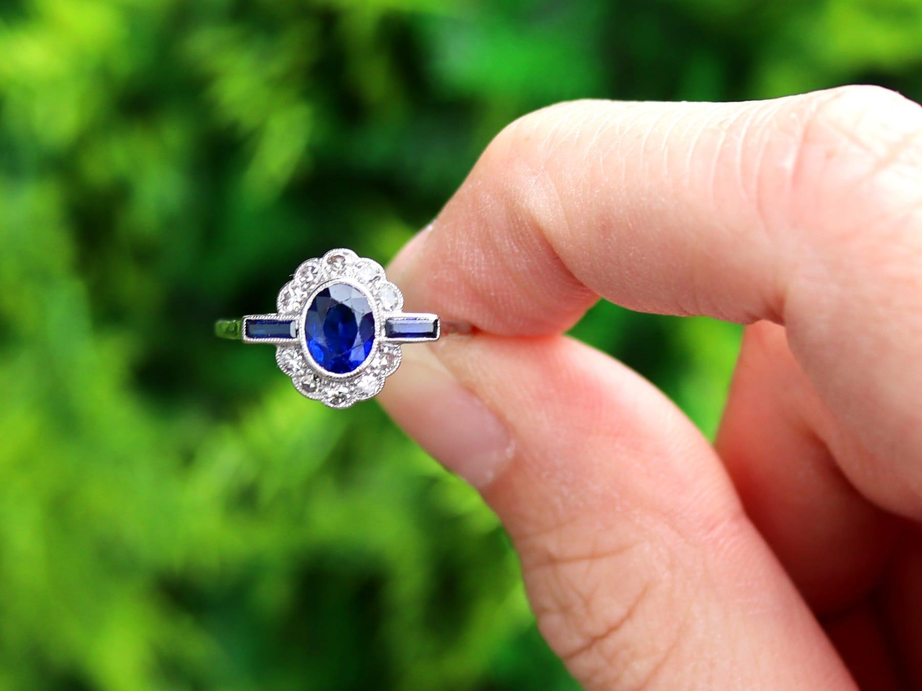 This fine and impressive antique sapphire and diamond ring has been crafted in 18k white gold with a platinum setting.

The pierced decorated setting is ornamented with a feature millegrain decorated collet set 1.20ct oval faceted cut blue