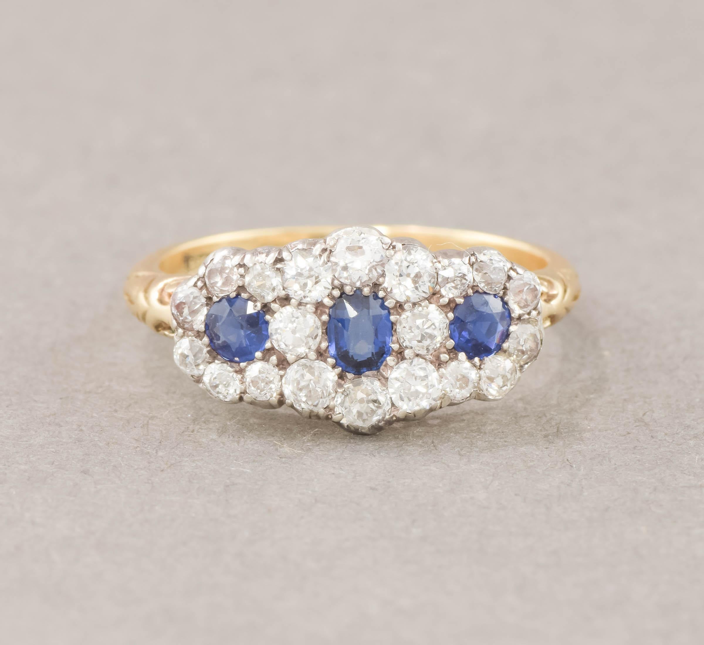 Offered is an elegant & extremely sparkly late Victorian Old European Cut Diamond and Blue Sapphire Ring.

Estimated at approximately 1.20 carats of bright and fiery old cut diamonds and approximately .56 carats of old cut blue sapphires set in