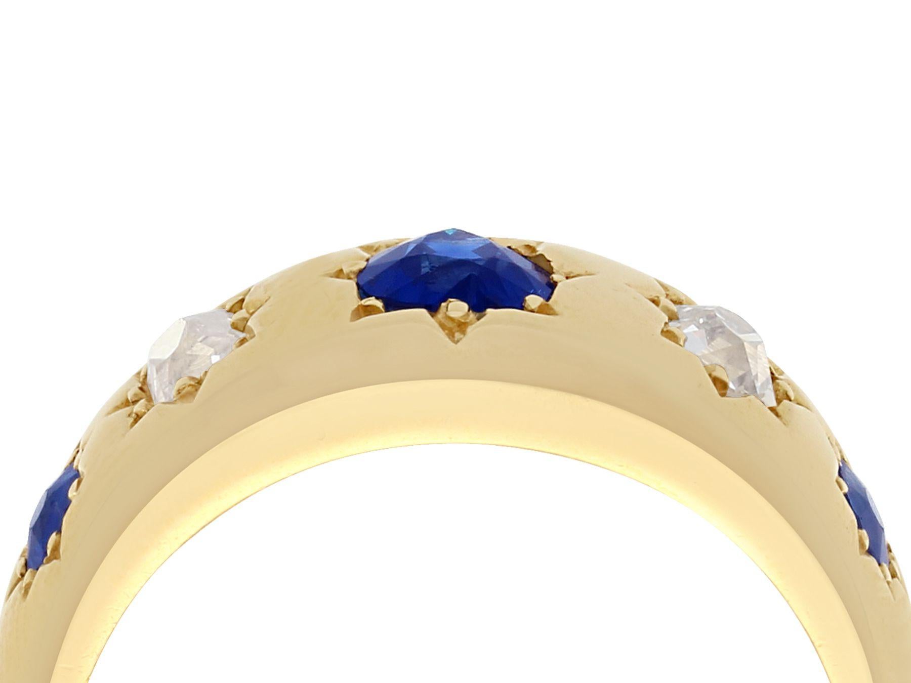A fine and impressive antique Victorian 0.73 carat natural sapphire and 0.40 carat diamond, 18 karat yellow gold dress ring; part of our antique jewelry and estate jewelry collections.

This impressive sapphire and diamond ring has been crafted in