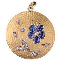 Antique Sapphire Flower Pendant of 18k Gold