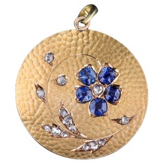 Antique Sapphire Flower Pendant of 18k Gold